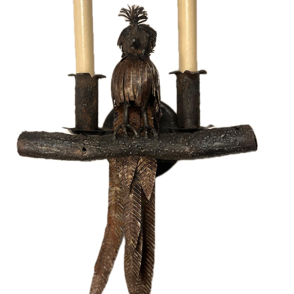 Pair of circa 1960's Italian hammered iron bird sconces with original patina.

Measurements:
Height: 17.75