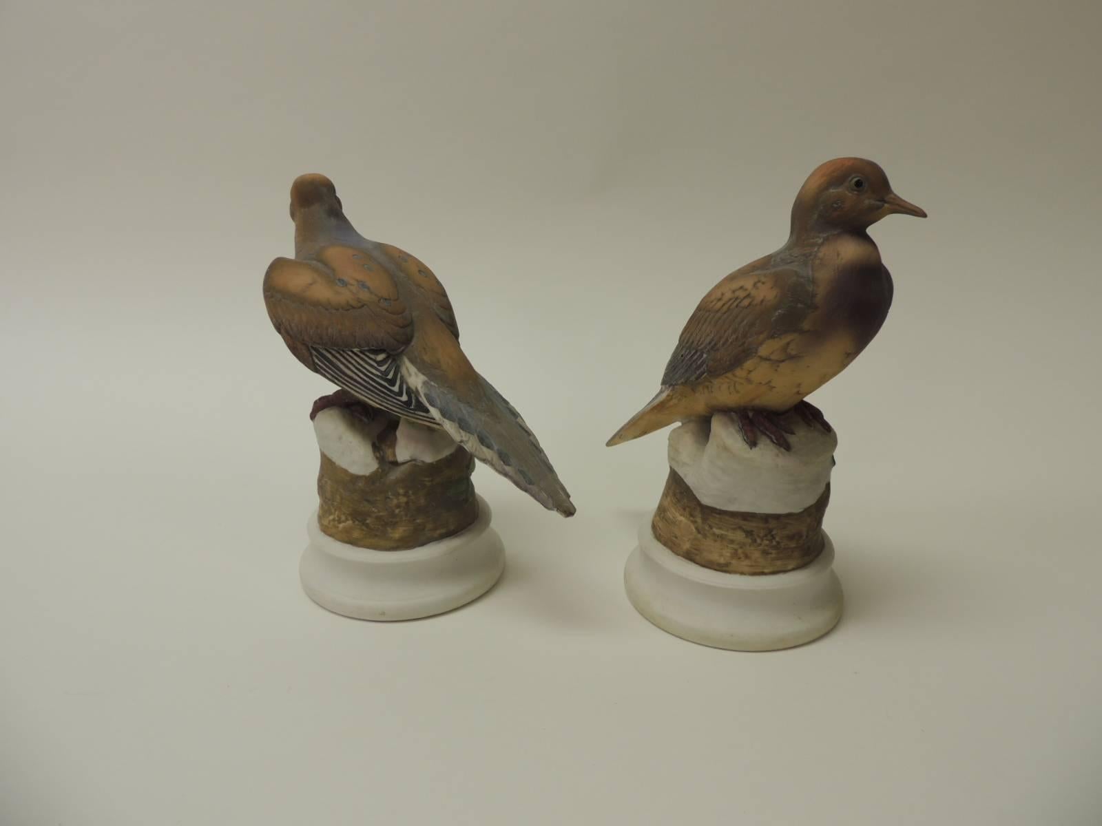 Pair of vintage bisque ceramic Morning doves figurines
Vintage pair of hand-painted morning (birds) doves figurines resting on tree trunks stems in bisque ceramic. In shades of brown, tan, green and white. Signed: Morning Doves by Andrea.
What is