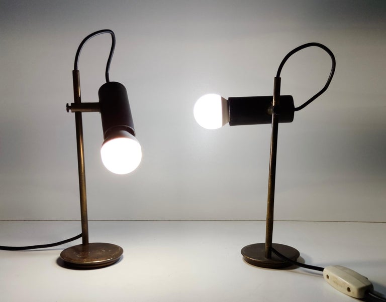 Italy, 1950s.
These table lamps are made in brass and black varnished steel. 
These lamps are vintage, therefore they might show slight traces of use, but they can be considered as in very good original condition.

Measures: 
Height 24 cm
Base