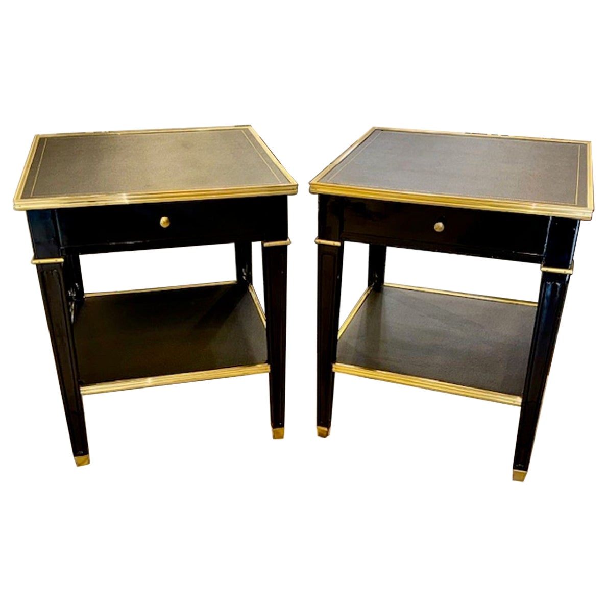 Coppia di tavolini d'epoca in ottone e laccato nero della Maison Jansen