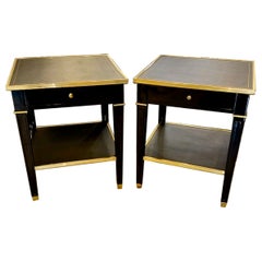 Coppia di tavolini d'epoca in ottone e laccato nero della Maison Jansen
