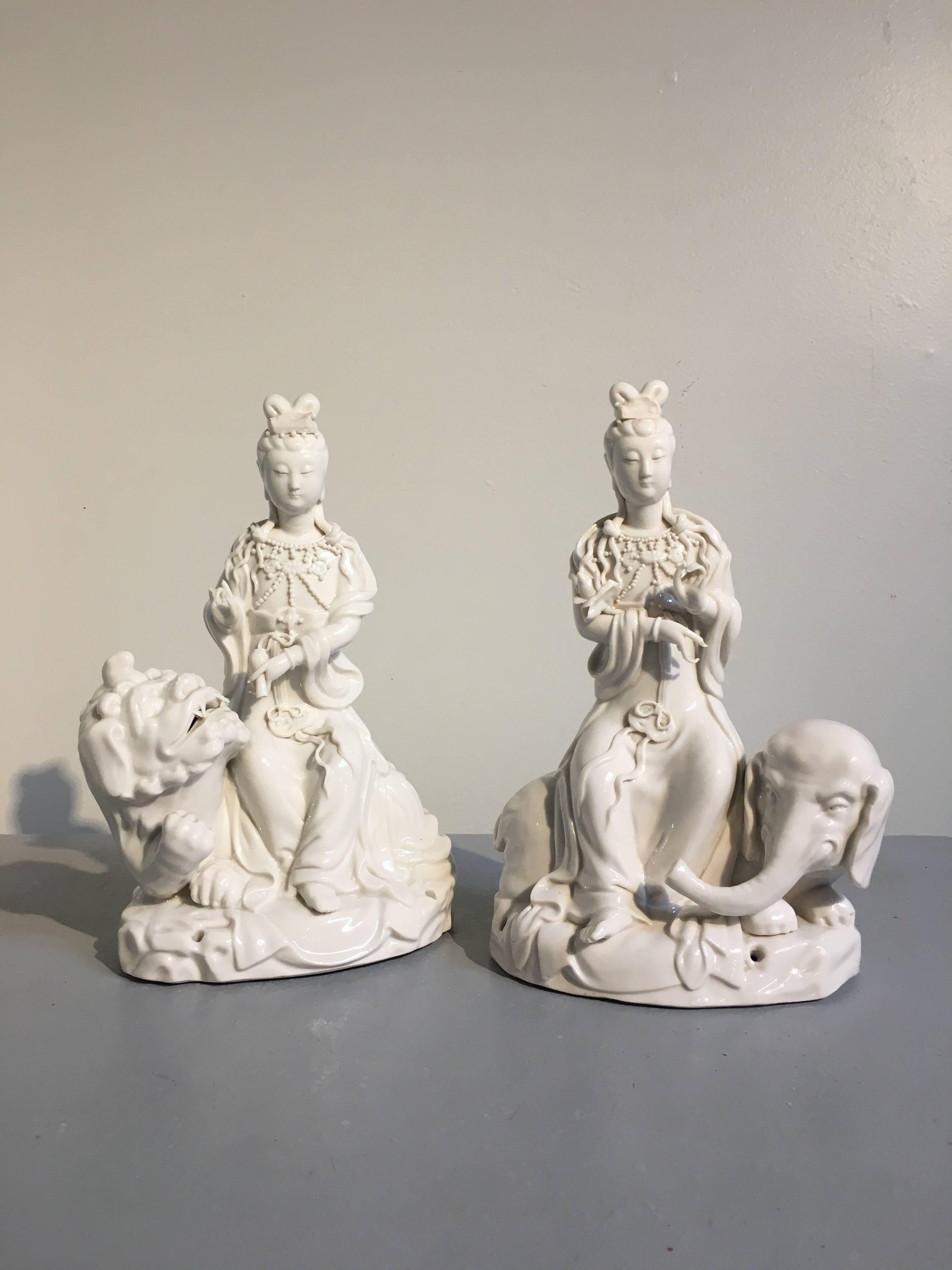 Chinoiserie Pair of Vintage Blanc de Chine Figures of Guanyin Riding an Elephant and Lion For Sale