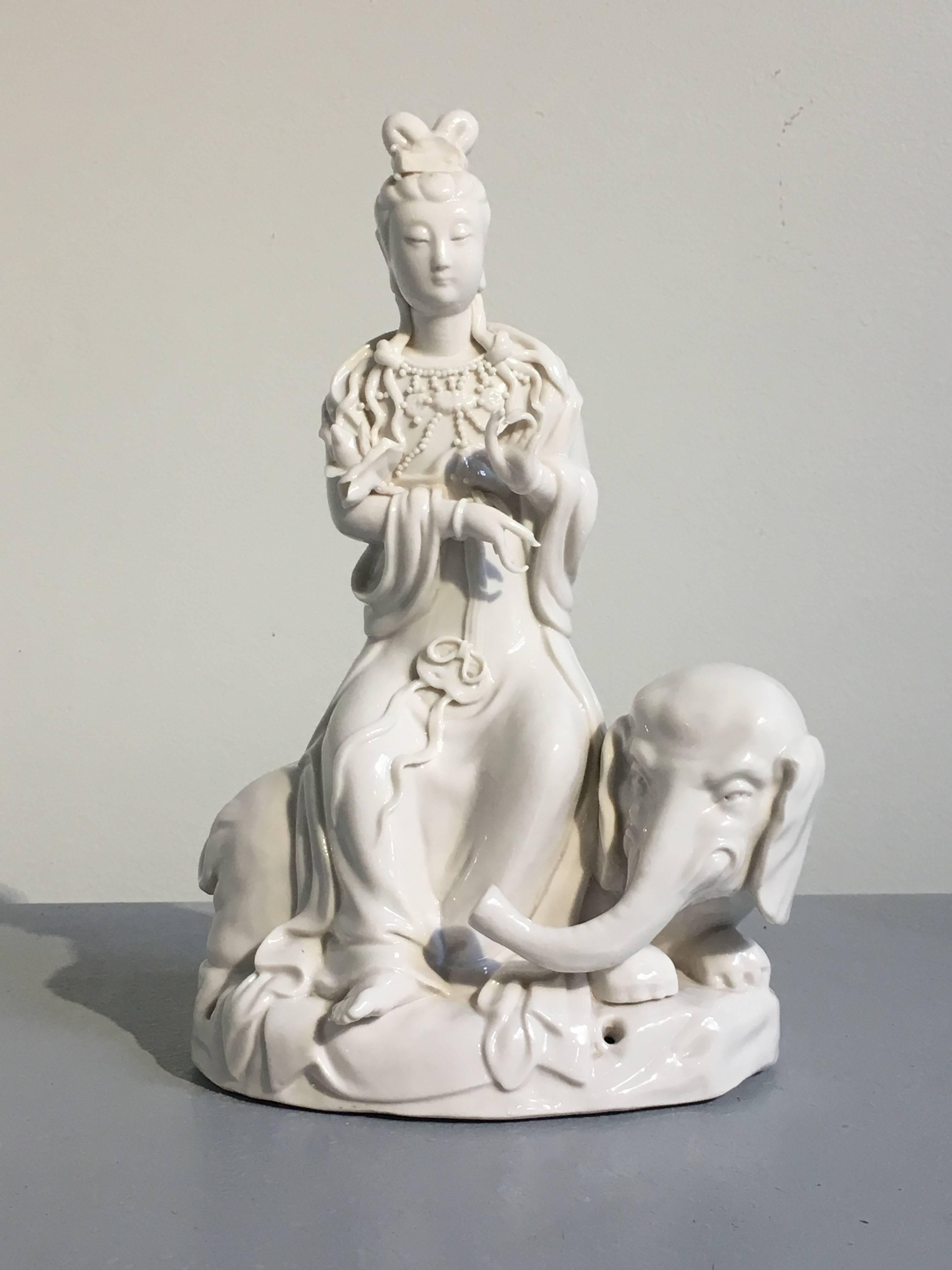 Mid-20th Century Pair of Vintage Blanc de Chine Figures of Guanyin Riding an Elephant and Lion For Sale