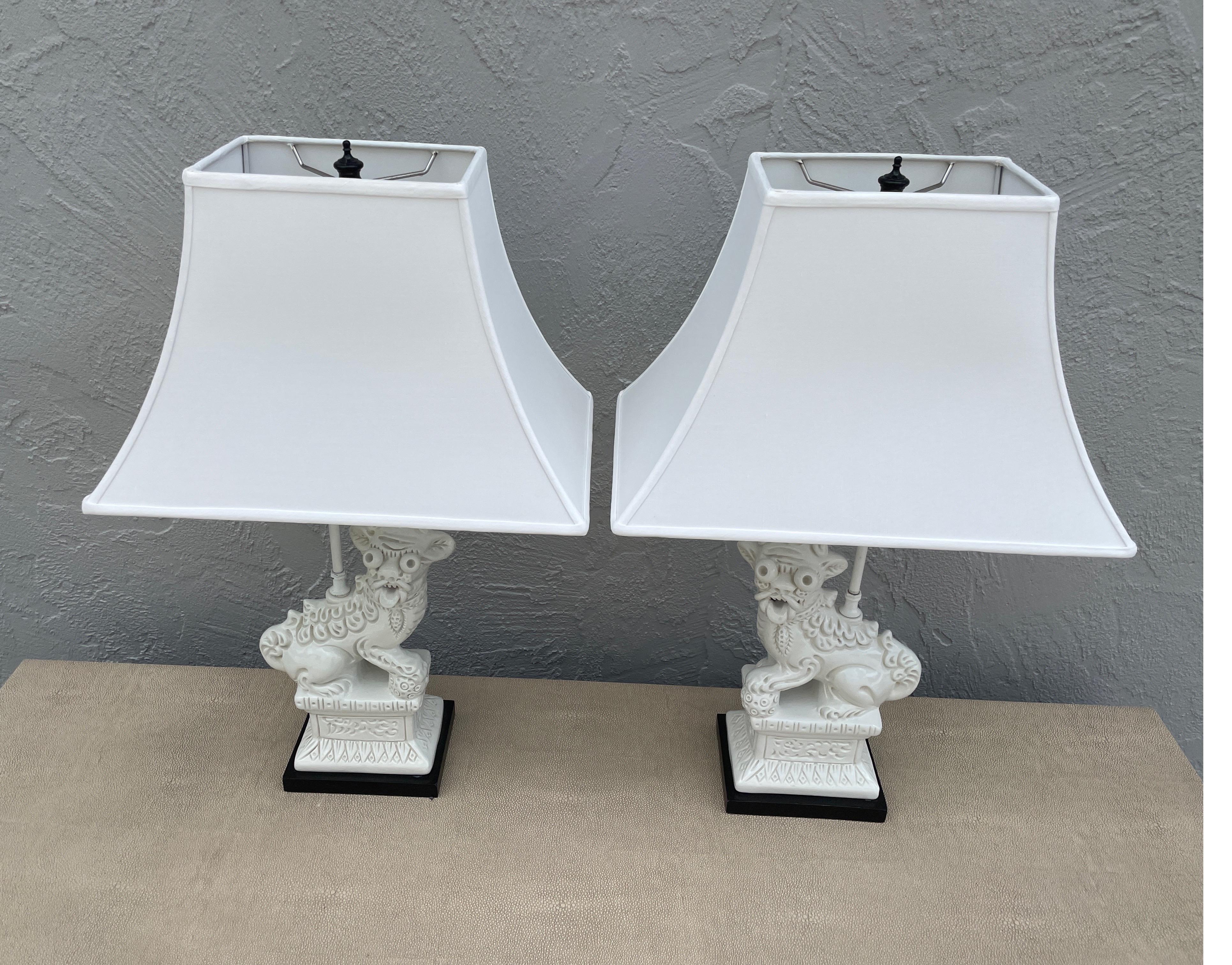 Vintage pair of Blanc de Chine Chinese Foo Dog Lamps with new shades.