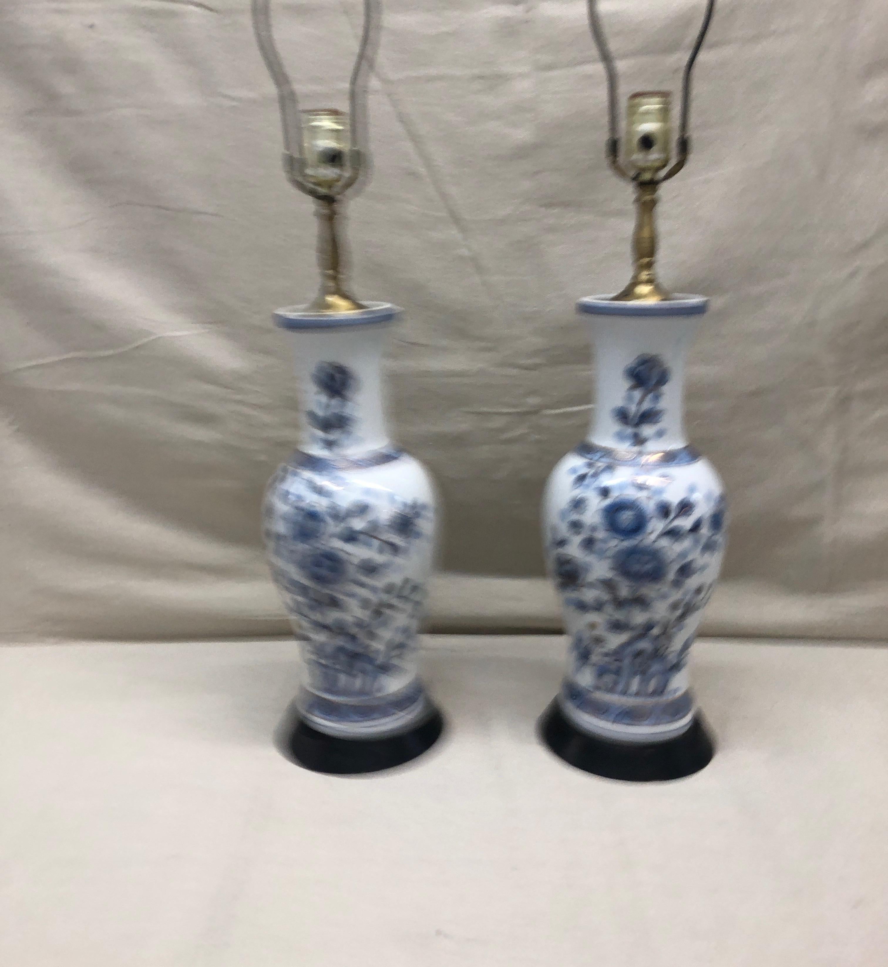 Pair of vintage blue and white Imari table lamps,
floral pattern with gold outline details.
Size: 6” D x 27” H to top of harp.
Vase: 6” D x 15” H.
