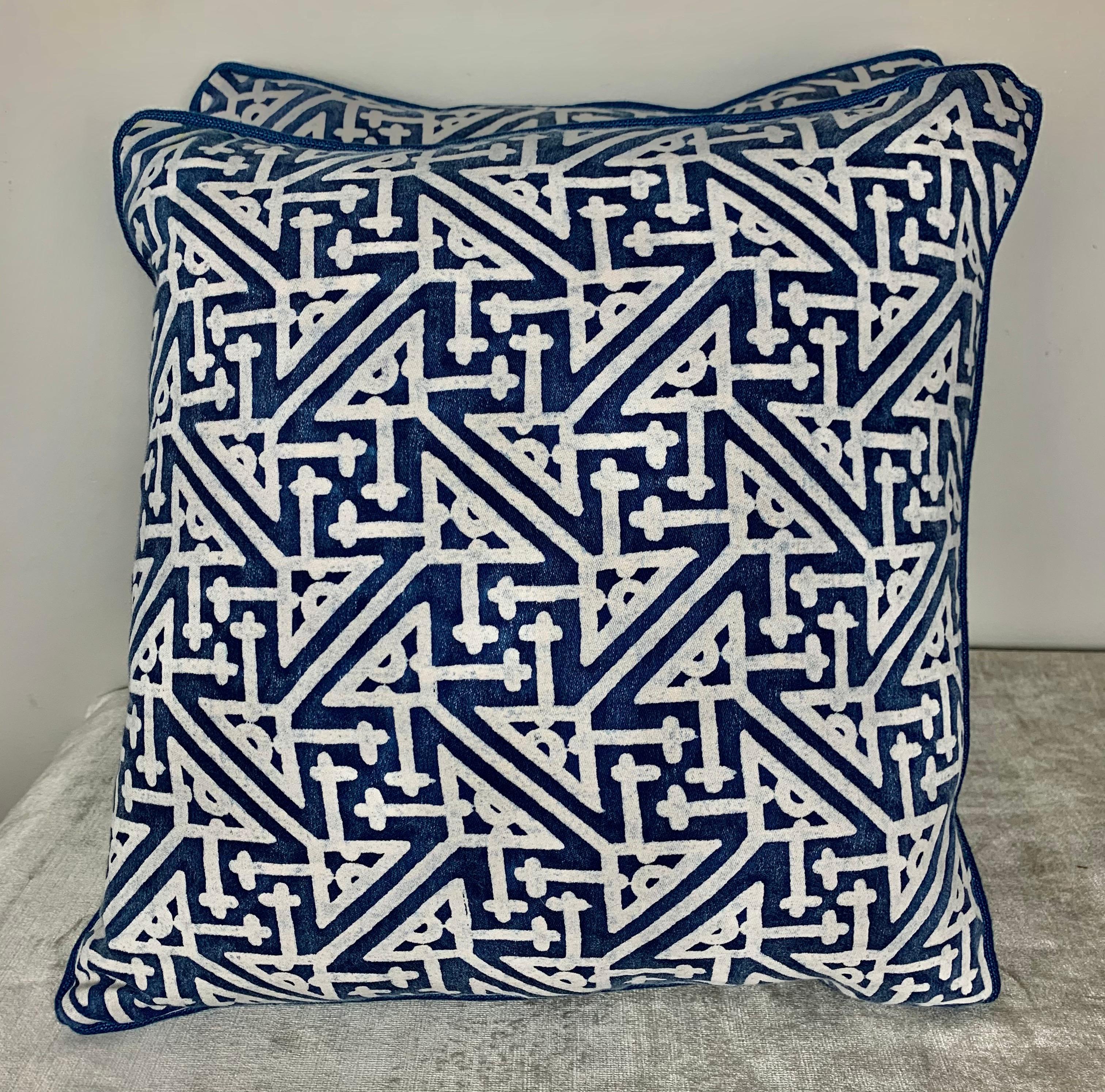 Pair of pillow made with vintage blue and white printed Fortuny cotton fronts and dark blue linen backs. Self-cord detail, down inserts, sewn closed.
