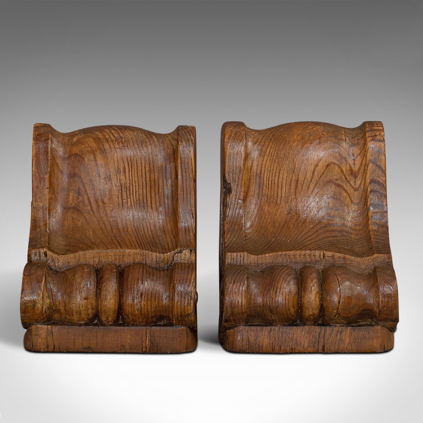 This is a pair of vintage bookends. An English, pitch pine corbel crafted from timber taken from Wren's Church in London, dating to the 20th century.

Antique timber repurposed into handy bookends
Displays a desirable aged patina
Pitch pine