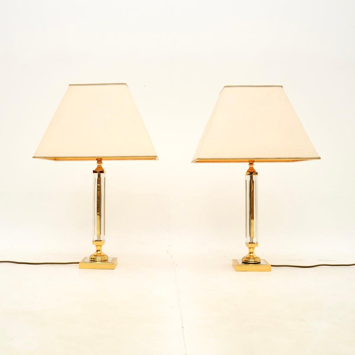 A smart and stylish pair of vintage brass and glass table lamps. They were made in Germany by Palwa, they date from the 1970’s.

The quality is outstanding, they have beautifully made clear glass, brass and chrome frames. The original shades are