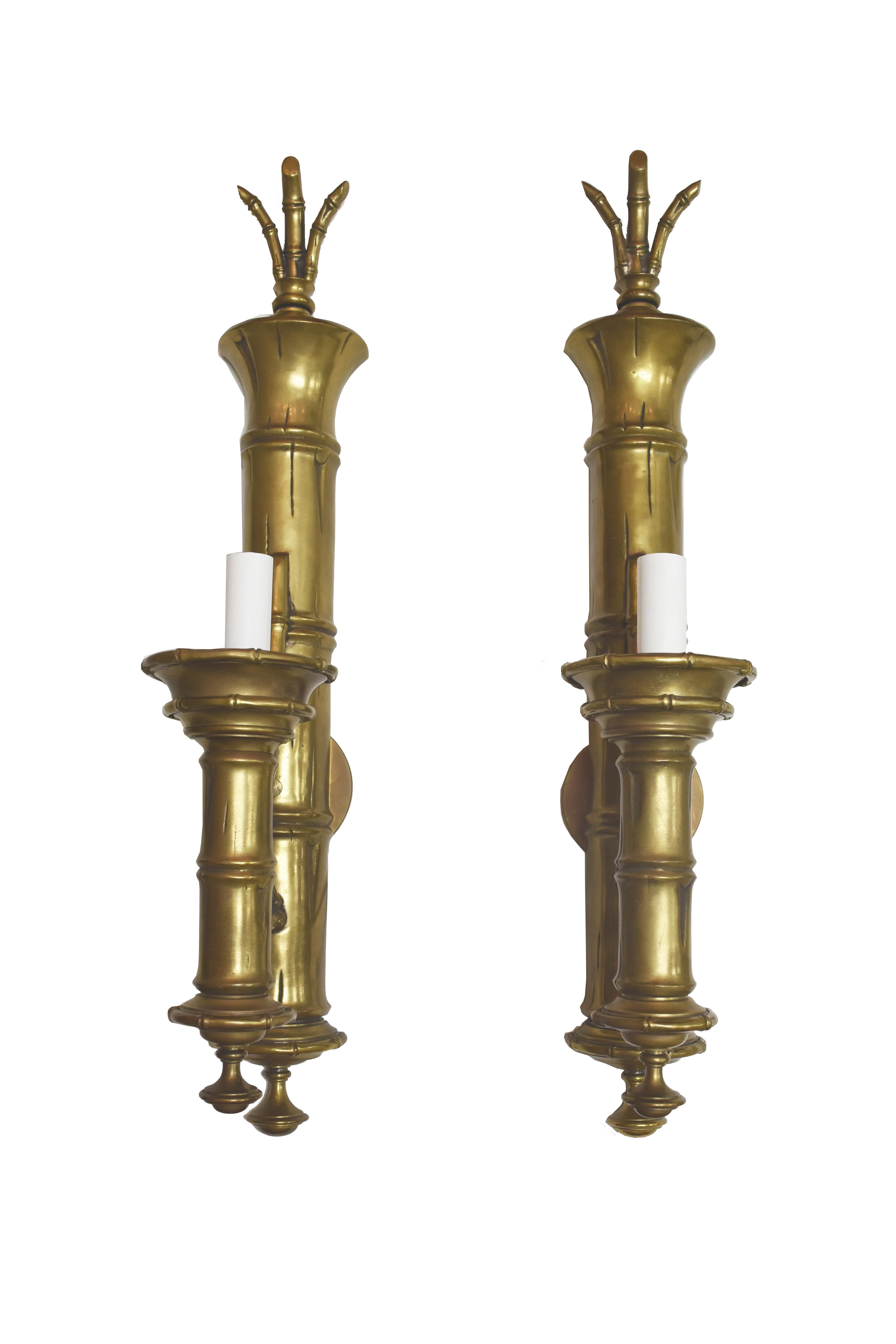 There are actually two pair (a total of four) of these large vintage brass bamboo sconces believed to be by E.F. Chapman. The bamboo design is not only on the sconce back but also at the base of the hurricane shade and around the top of the