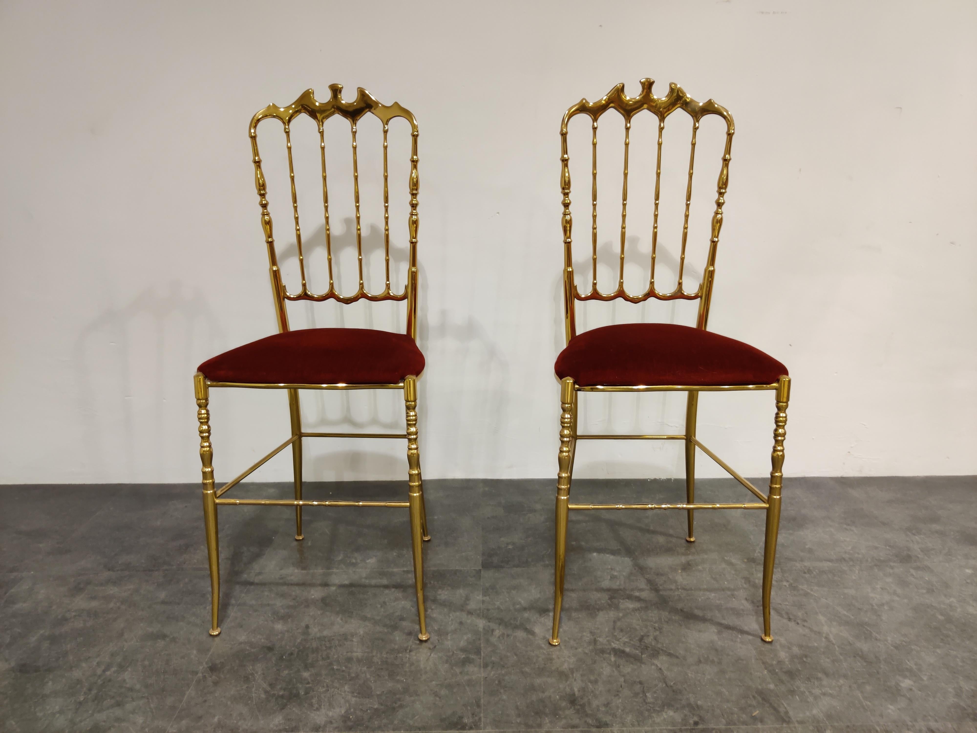 Beautiful and elegant Chiavari chairs in polished brass and a red velvet seats.

Designed by Giuseppe Gaetano Descalzi and produced since the early 19th century in the Ligurian town of Chiavari, Italy.

The chairs can be used for a desk, as