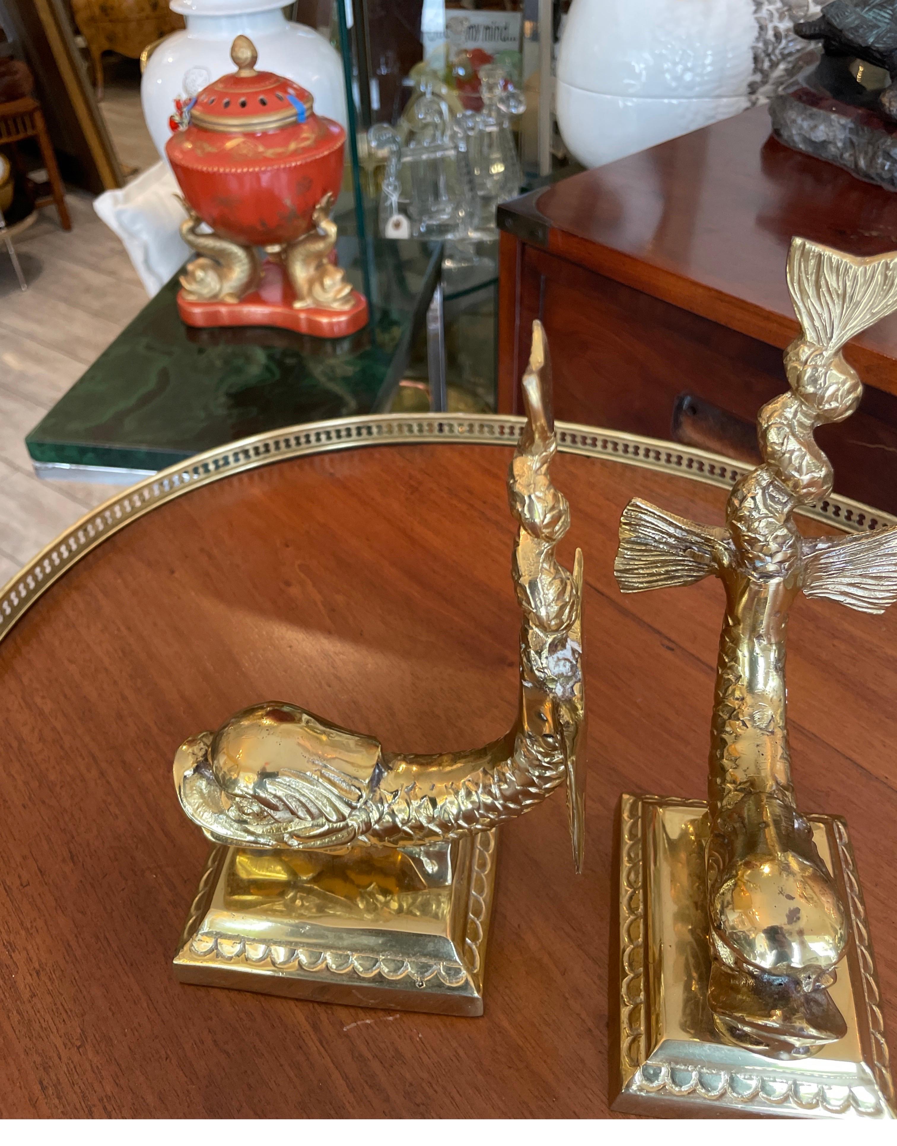Vintage pair of solid brass dolphin bookends. Very nice details throughout.
