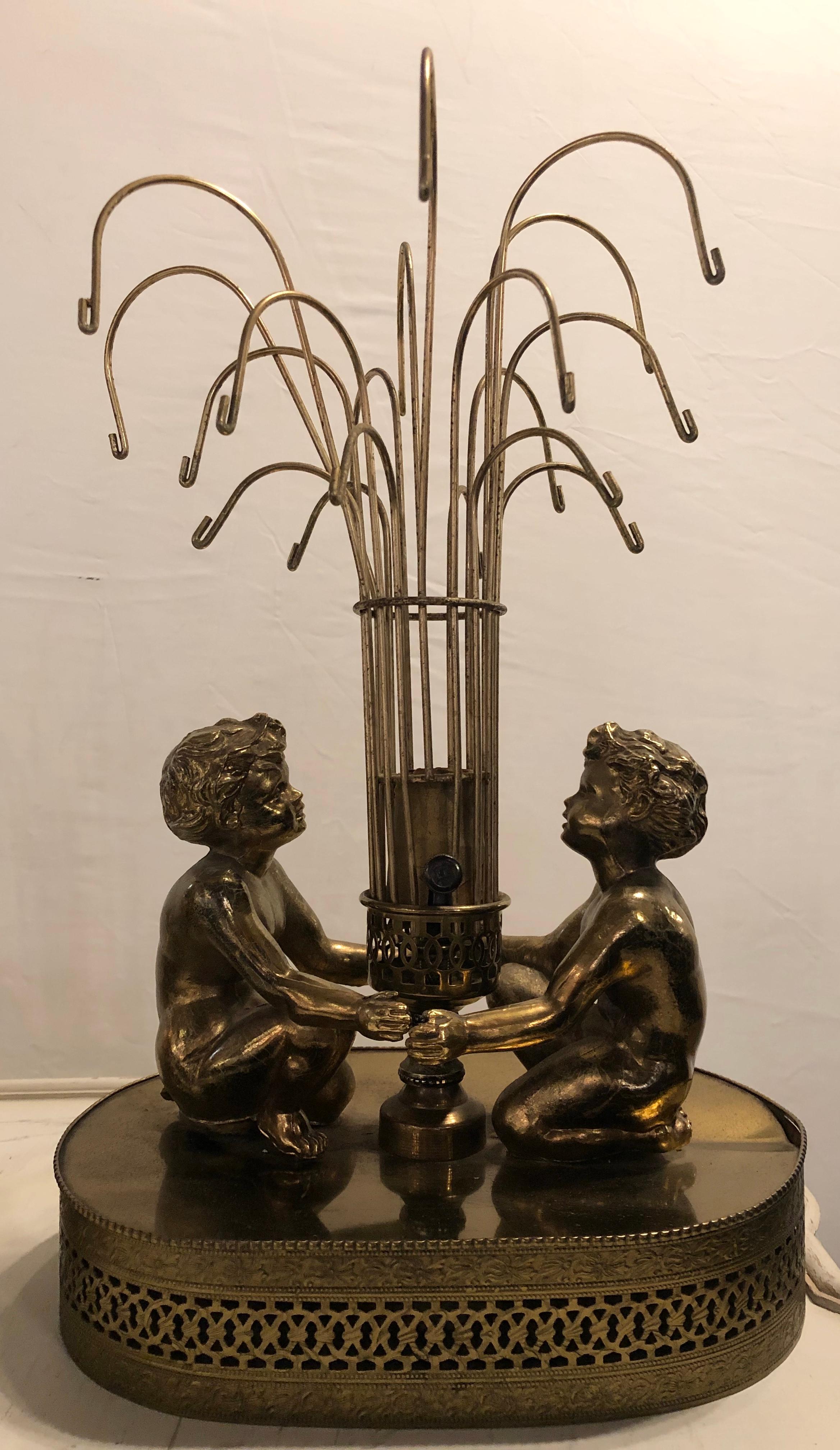Pair of Vintage Brass Double Cherub Table Lamps In Fair Condition In Stamford, CT
