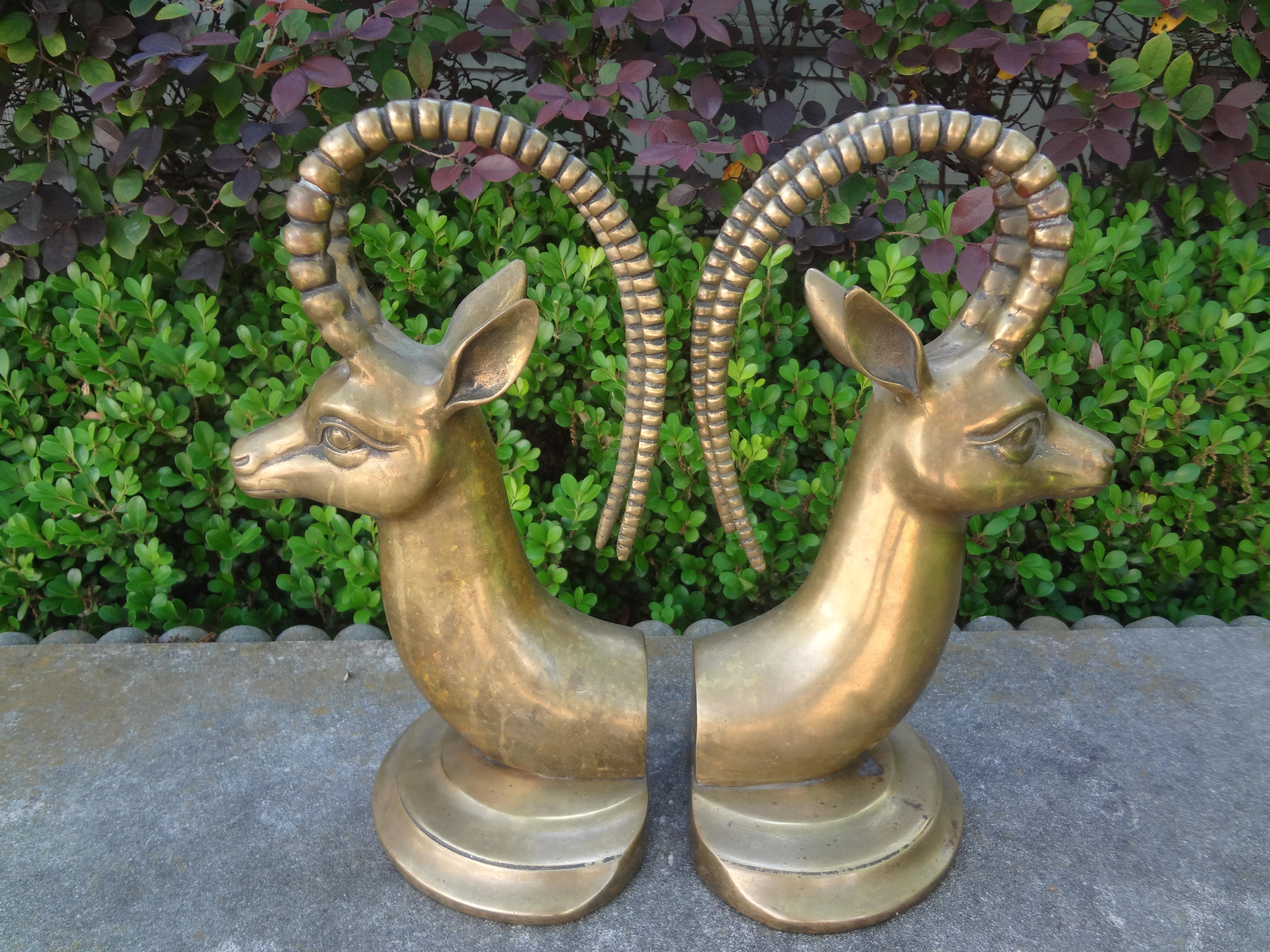 Pair Of Vintage Brass Ibex Bookends.
Our large pair of Hollywood Regency brass ibex bookends are substantial and can hold large scale or heavy books. Beautiful desk accessory, coffee table accessory or bookcase accessory. Great patina!