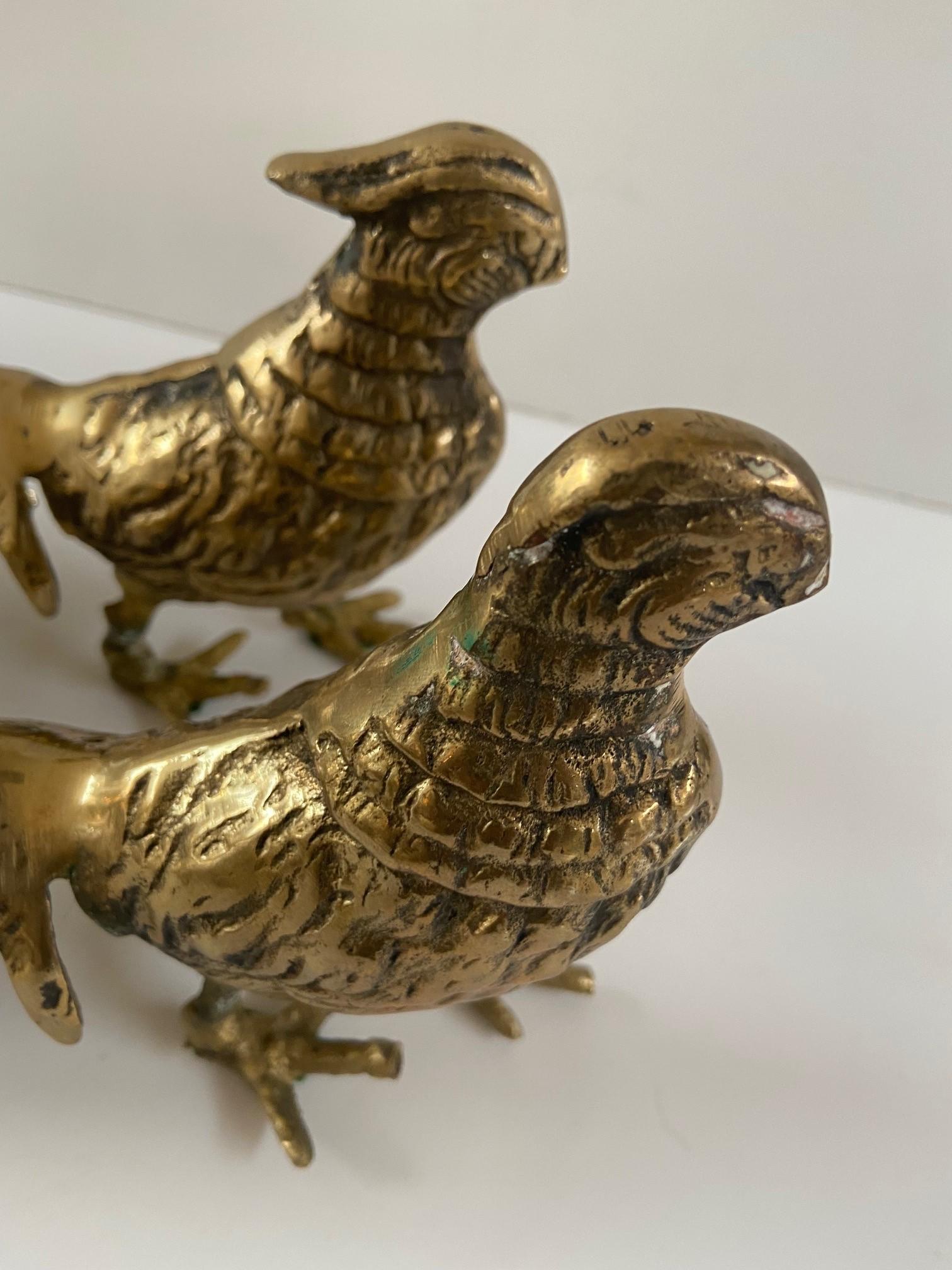 Pair of mid century brass metal pheasant birds sculptures, one male, and one female.