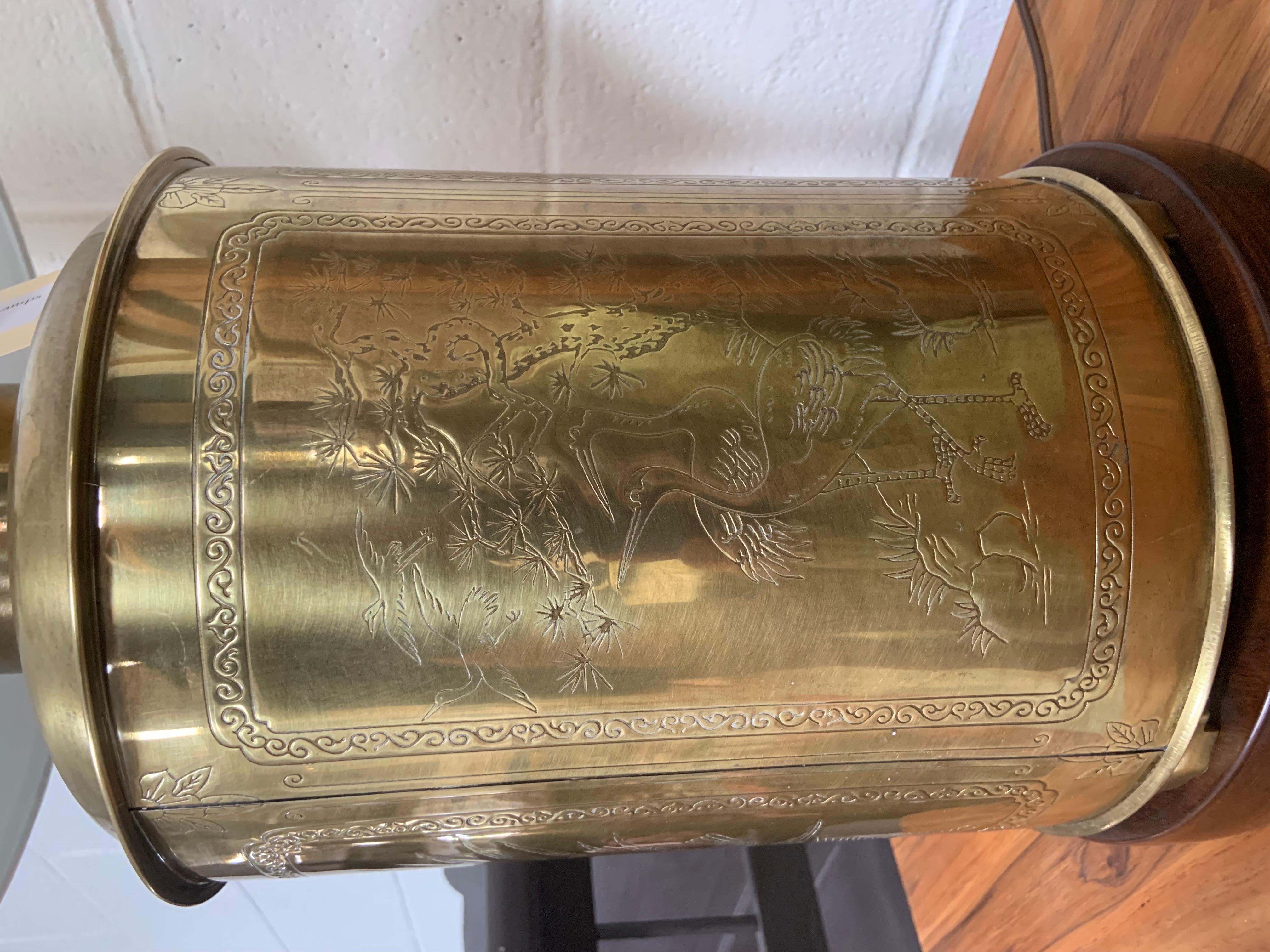These brass oriental lamps have developed a gorgeous aged patina and are decorated with engraved birds, flowers and symbols. See close up photos for details. Lamps are in great working condition and fits a regular bulb.
New shades are