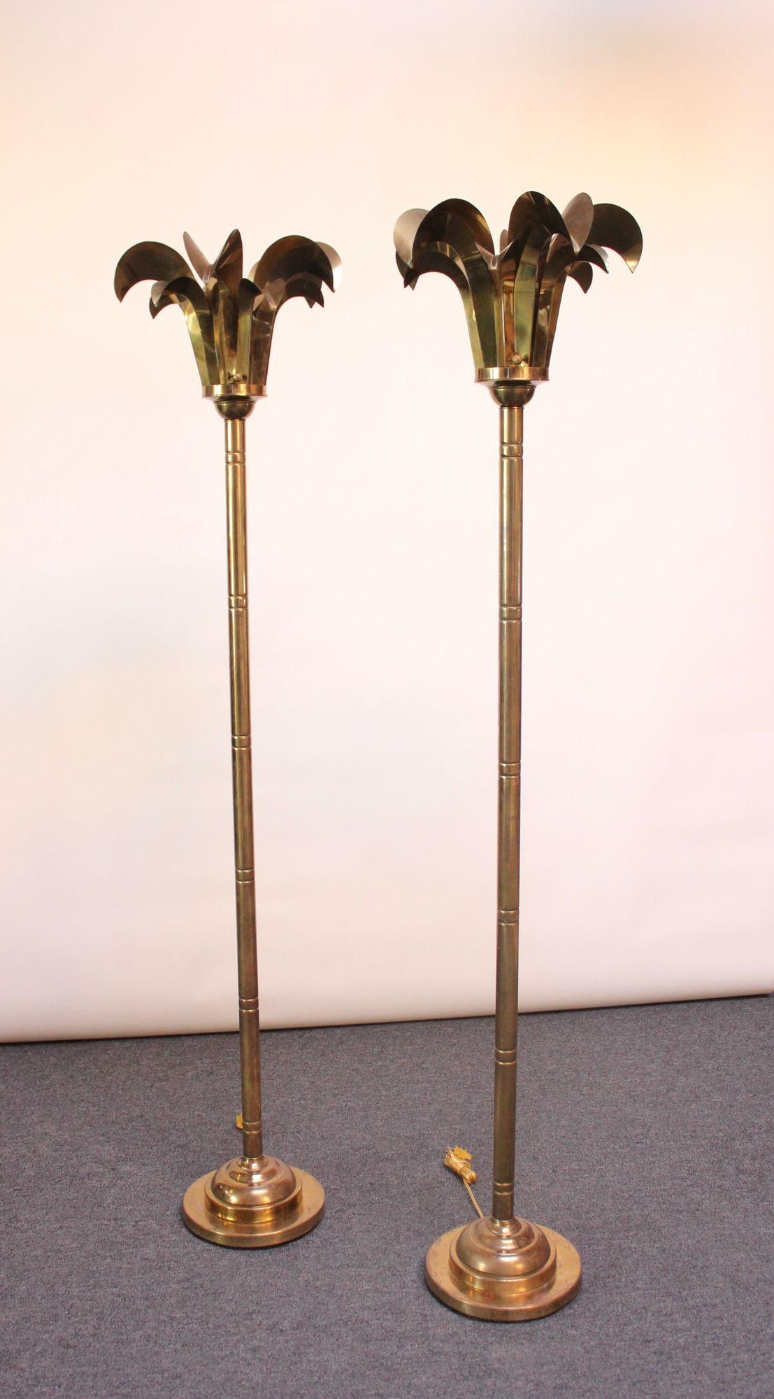 Pair of Hollywood Regency-style brass floor lamps fashioned after palm trees manufactured by Hart Associates (ca. 1970, USA).
Solid, unpolished brass with rich patina/wear, as shown.
Elegant statement pieces exhibiting superior craftsmanship and