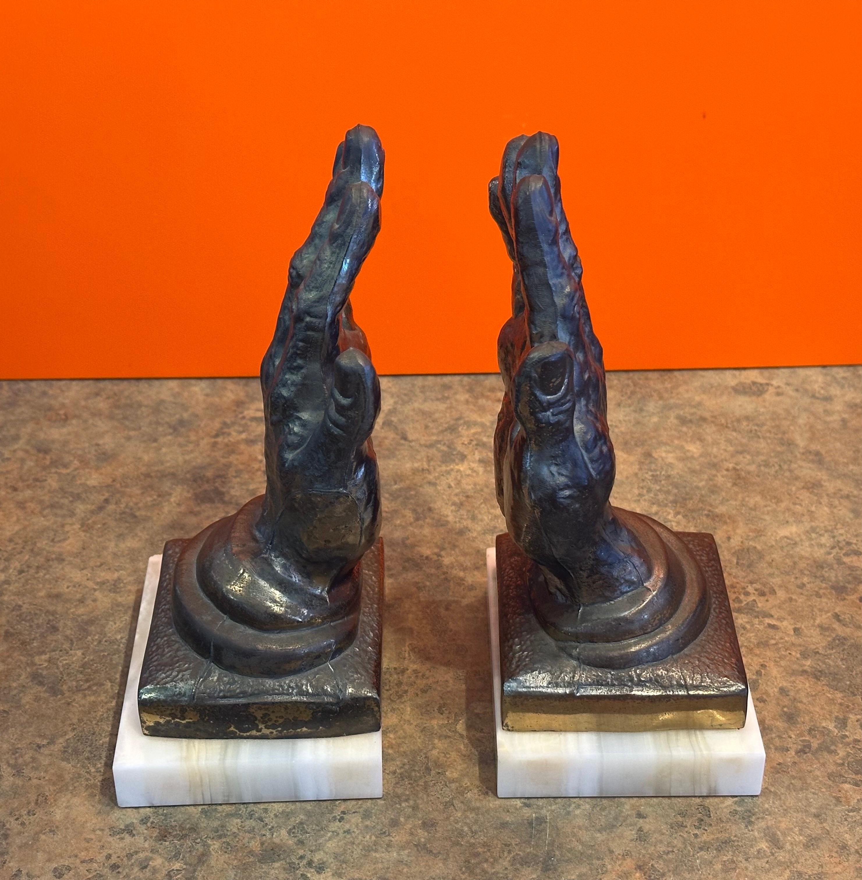 Coppia di reggilibri d'epoca in ottone 