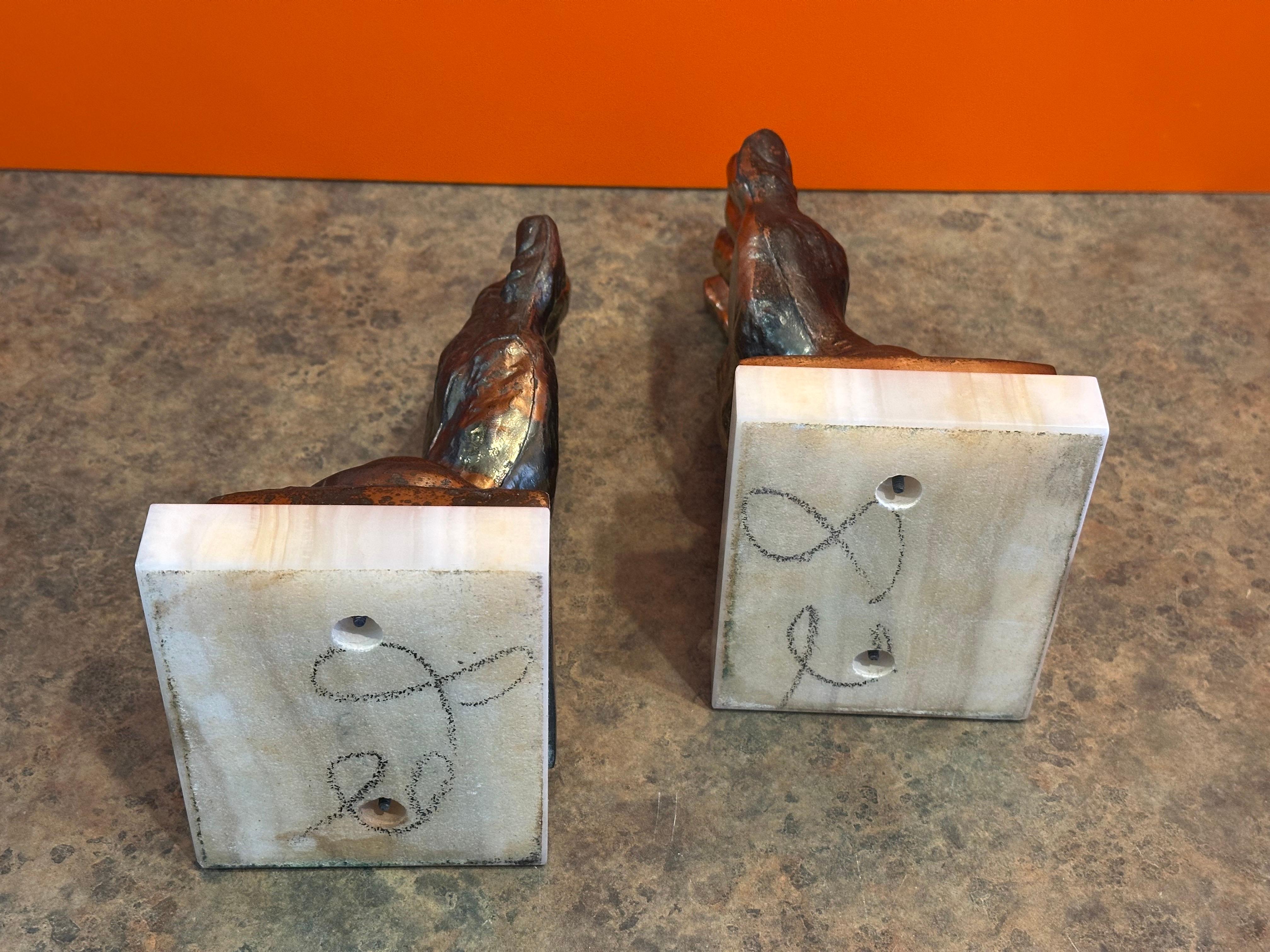 XX secolo Coppia di reggilibri d'epoca in ottone 