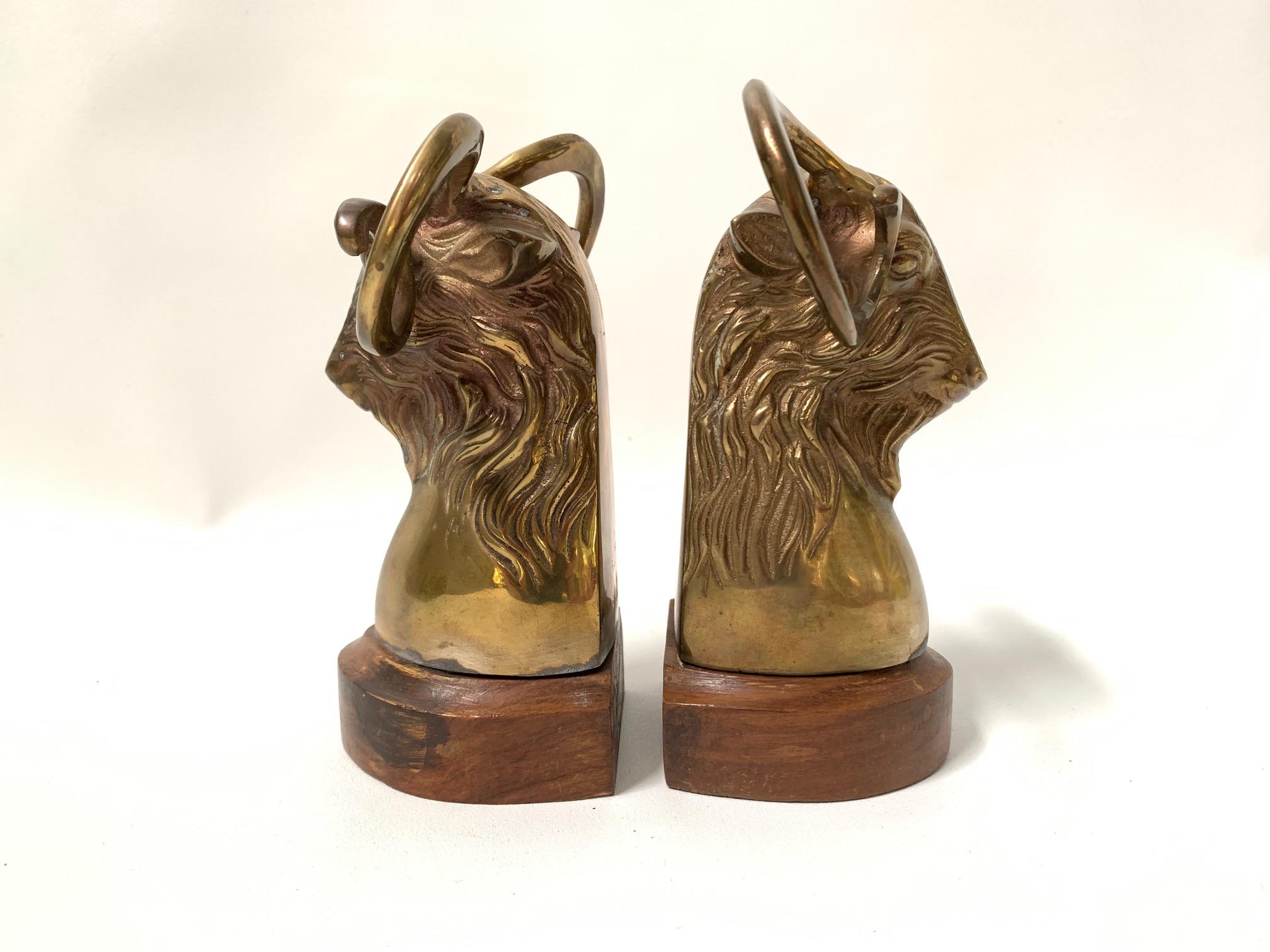 Pair of solid brass rams head bookends on wood bases. Made in India. Great as-found vintage condition.