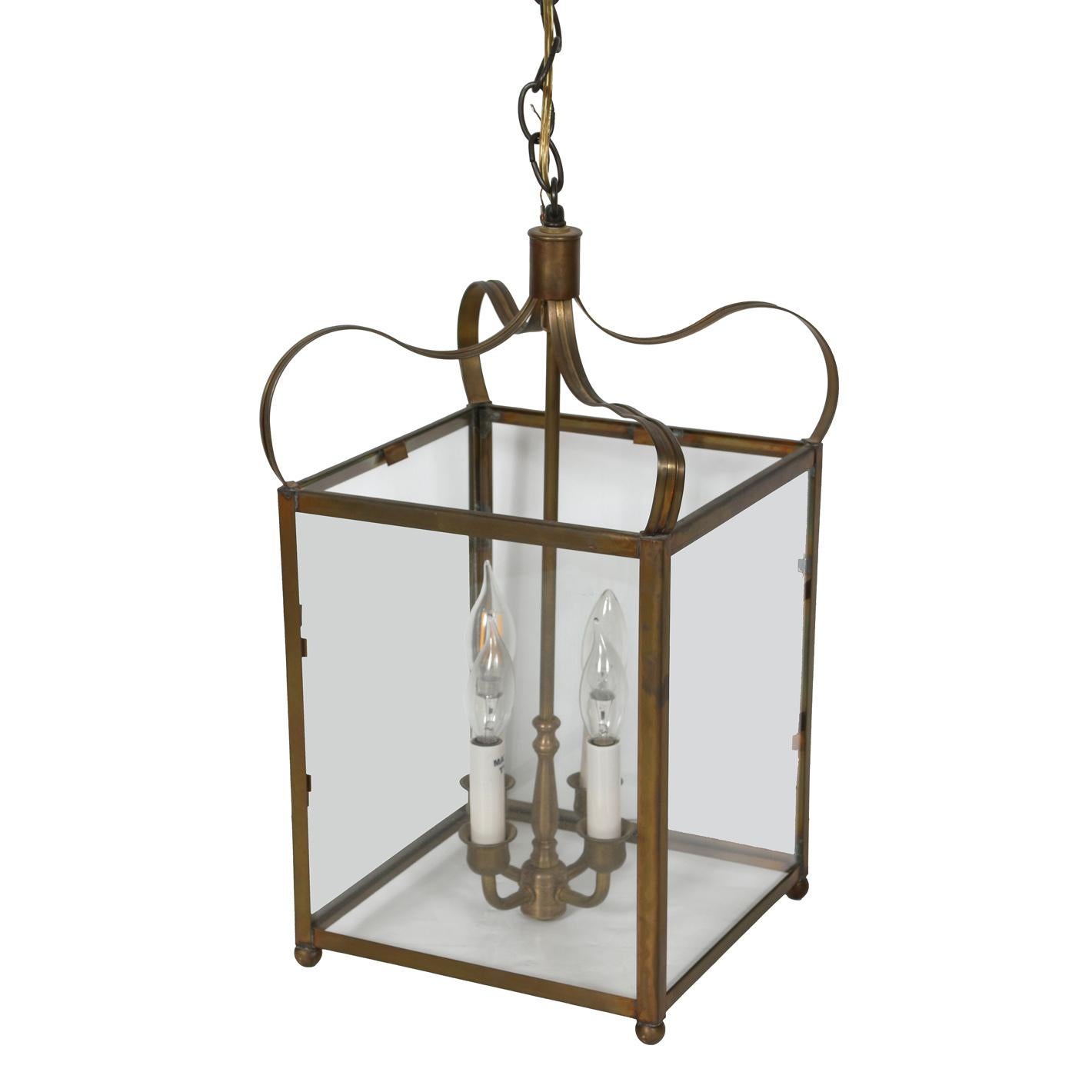 A pair of vintage brass square lanterns with four lights and shaped top, circa 1930.