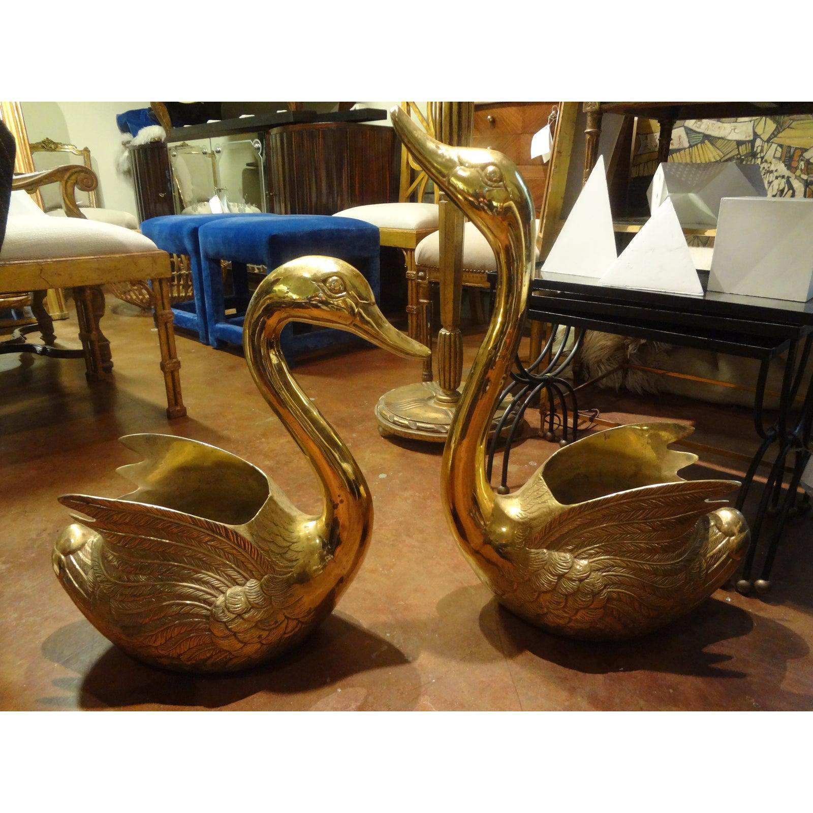 Pair of Vintage brass swan planters.
Monumental pair of Hollywood Regency brass swan planters, jardinières or cache pots. This beautiful pair of midcentury brass swans are large enough to display your favorite orchid plants or seasonal favorites.