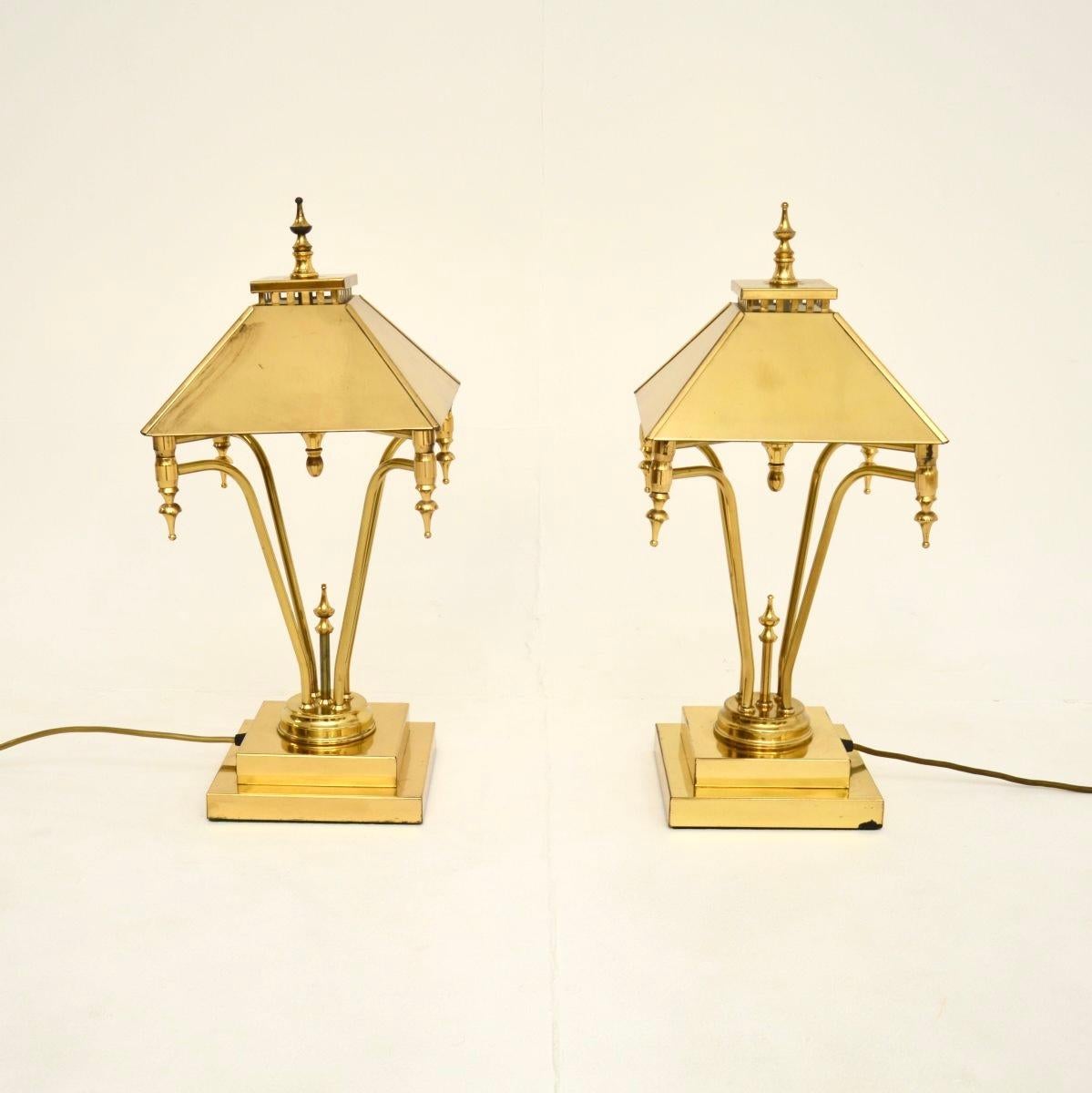 A stylish and extremely well made pair of vintage brass table lamps, made in England and dating from the 1970’s.

They are of amazing quality, with an unusual and very impressive design. They have a somewhat oriental influence to the design, they