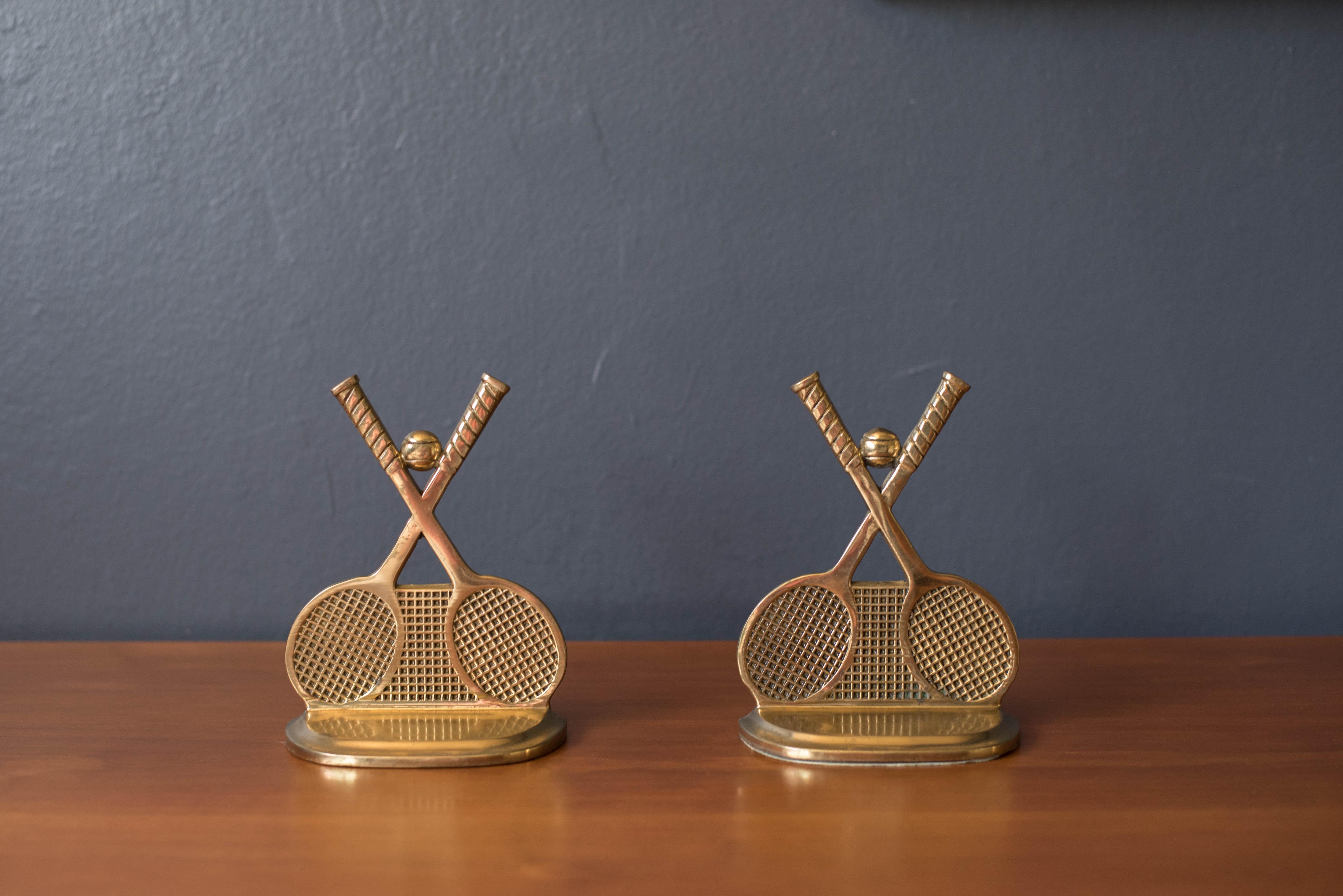 Pair of vintage Tennis Racquet Club bookends in brass circa 1970's. This heavy weighted set will keep your books organized and ready for display. Labeled CTC South San Francisco. 

