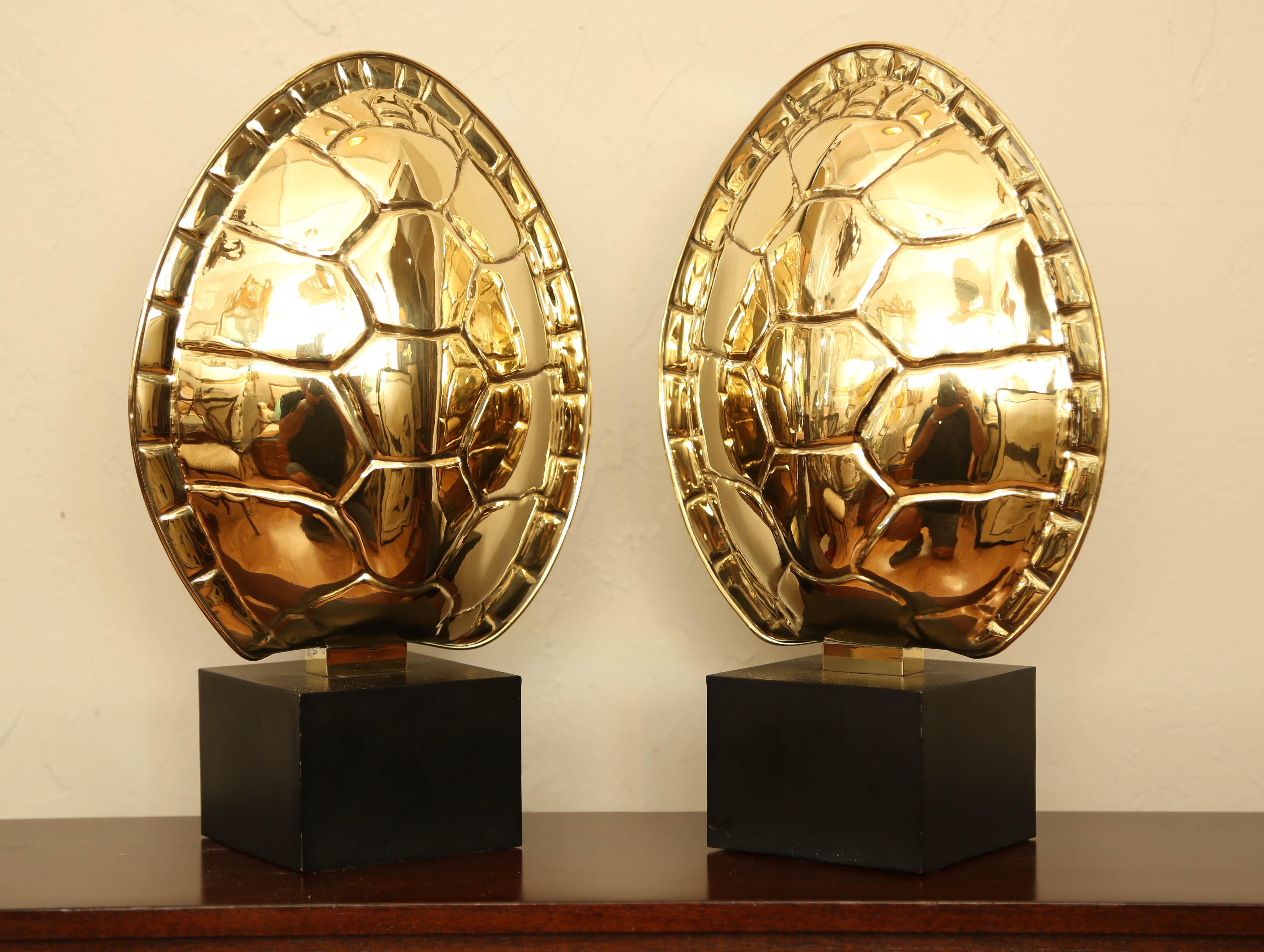 Pair of Chapman polished brass tortoise shell lamps.