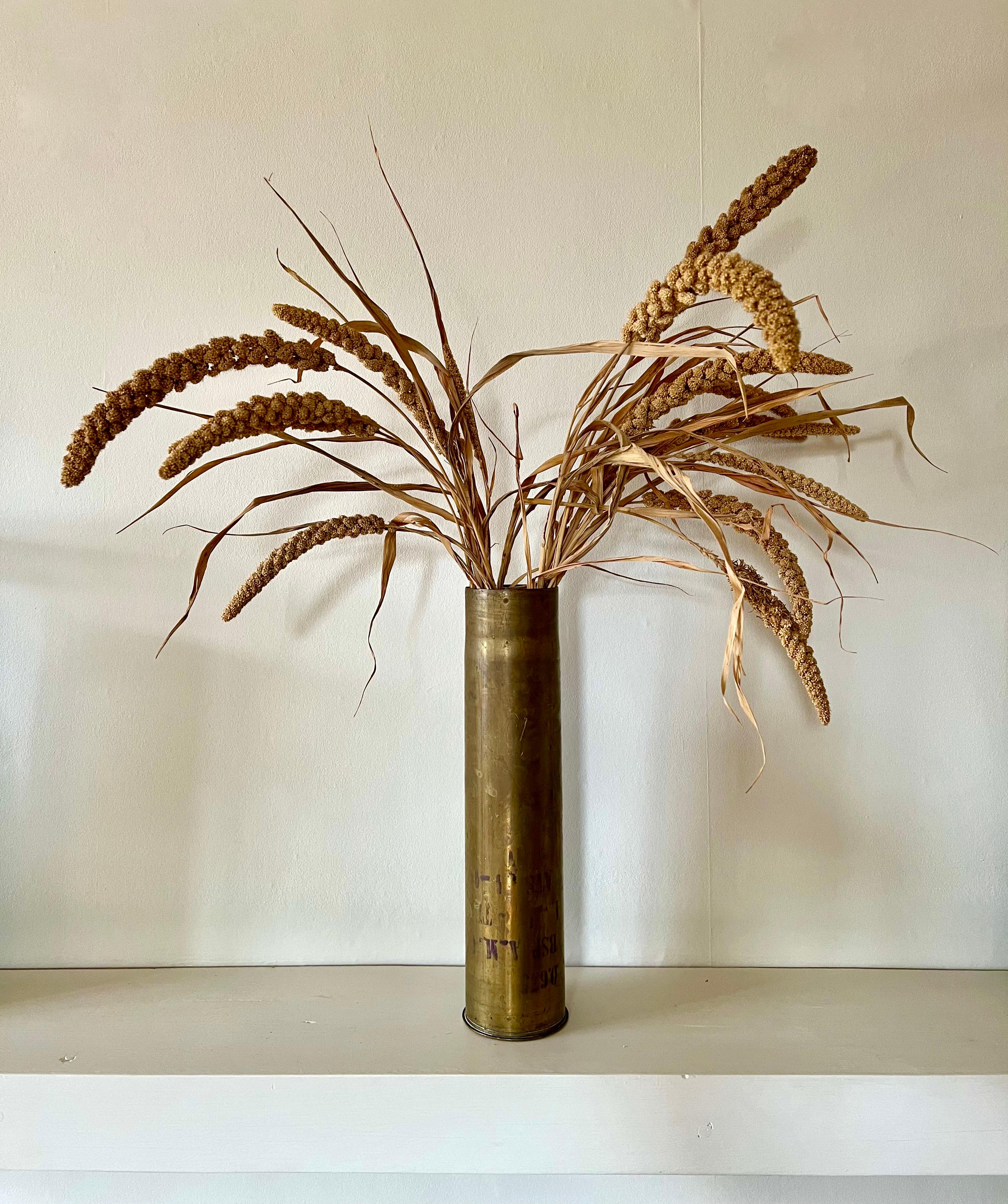 A pair of tall solid brass reclaimed vases

Early to mid 20th century reclaimed French WW1 or WW2 shells

In excellent condition. No dents, scratches or holes, great patina (could be polished to a shine if desired) and original markings one one