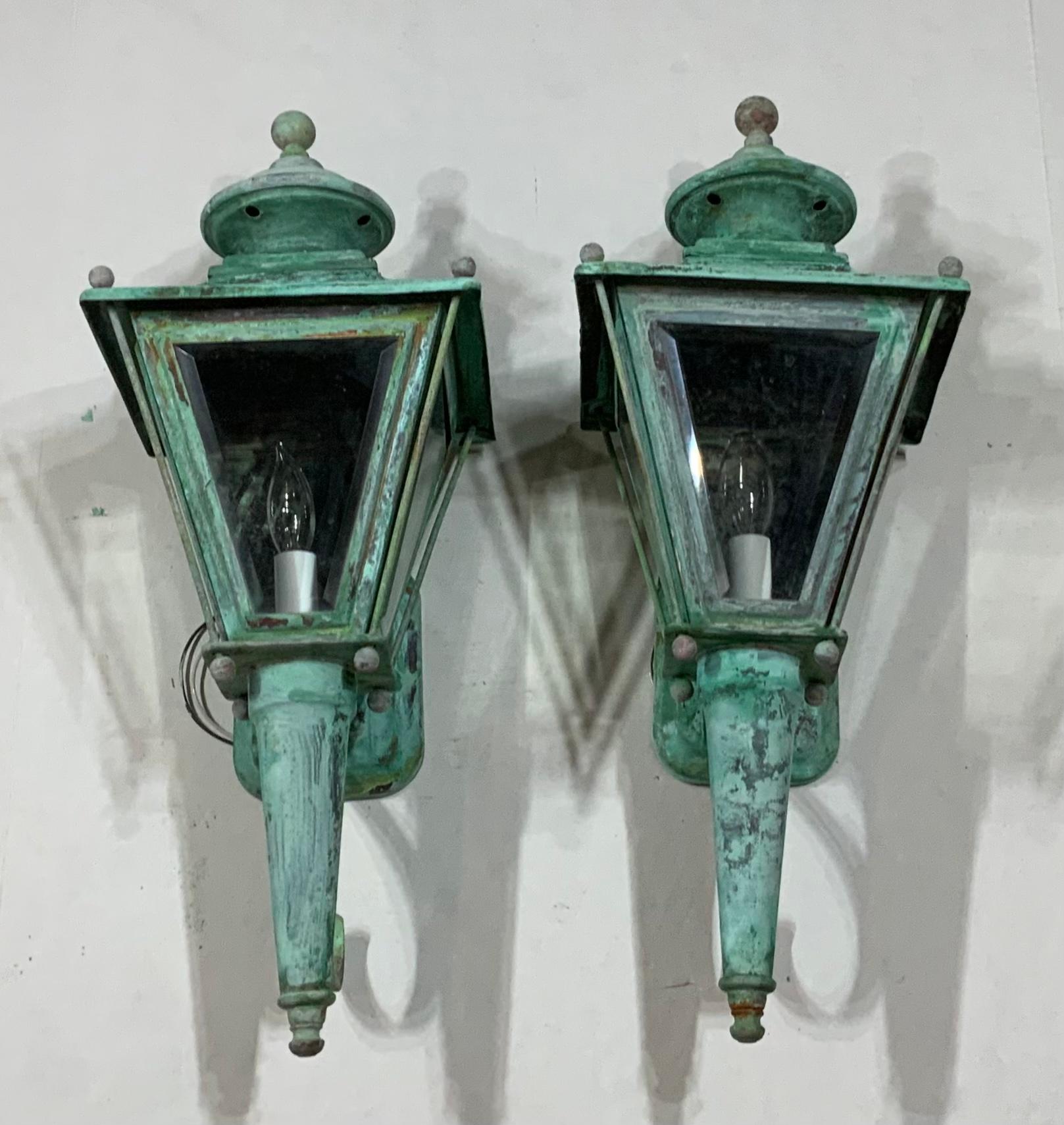 Elegant pair of vintage wall lantern hand crafted from brass with one 60/watt light each. Beveled glass.
This pair of lantern is newly electrified, one side glass panel is flat instead beveled.
Beautiful decorative pair of lantern indoor or