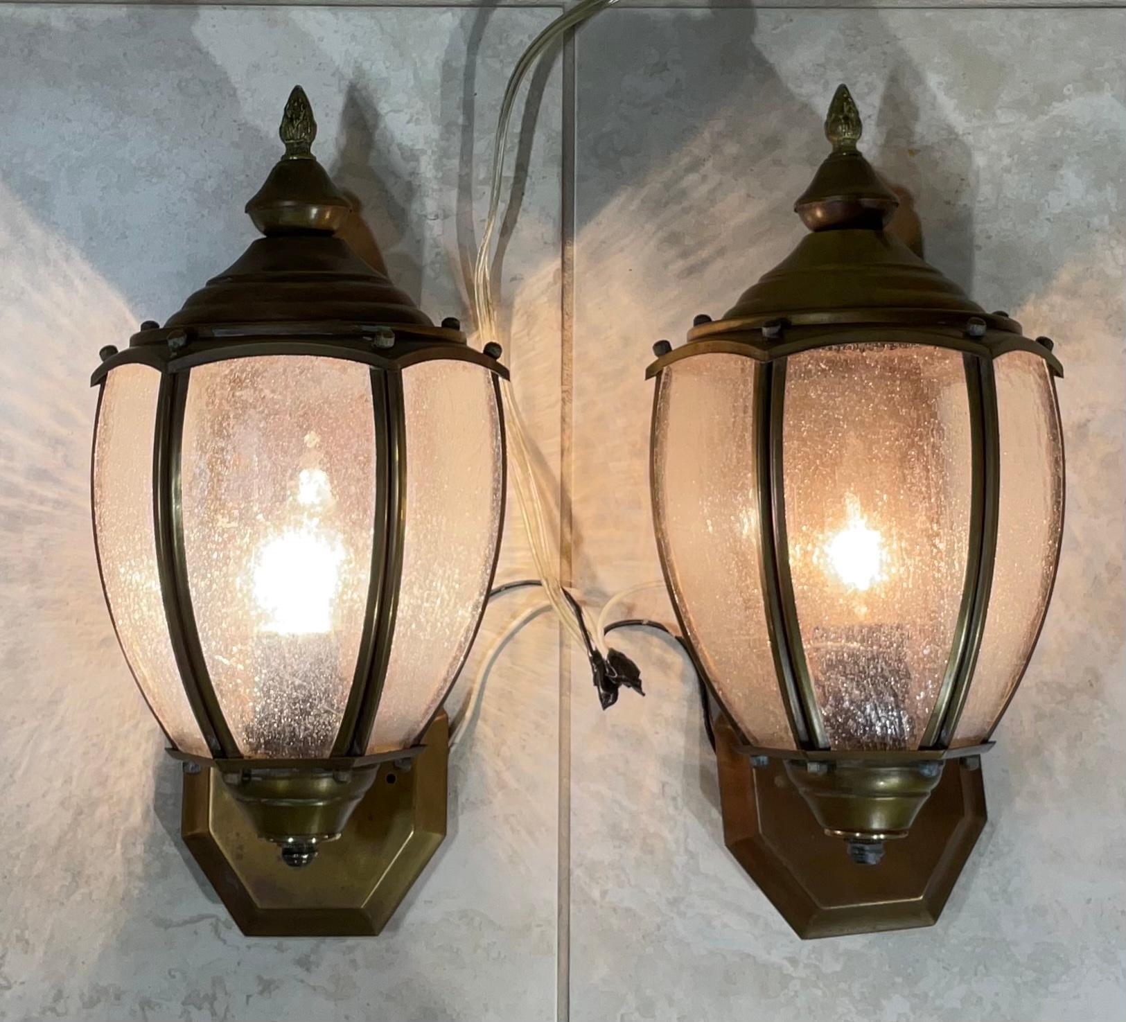 Elegant pair of vintage wall lantern hand crafted from brass with one 60/watt light each. Acrylic glass like . Suitable for wet location .
Beautiful decorative pair of lantern indoor or outdoor.
 Backplate size is “5”.5 high x 4”.75 wide