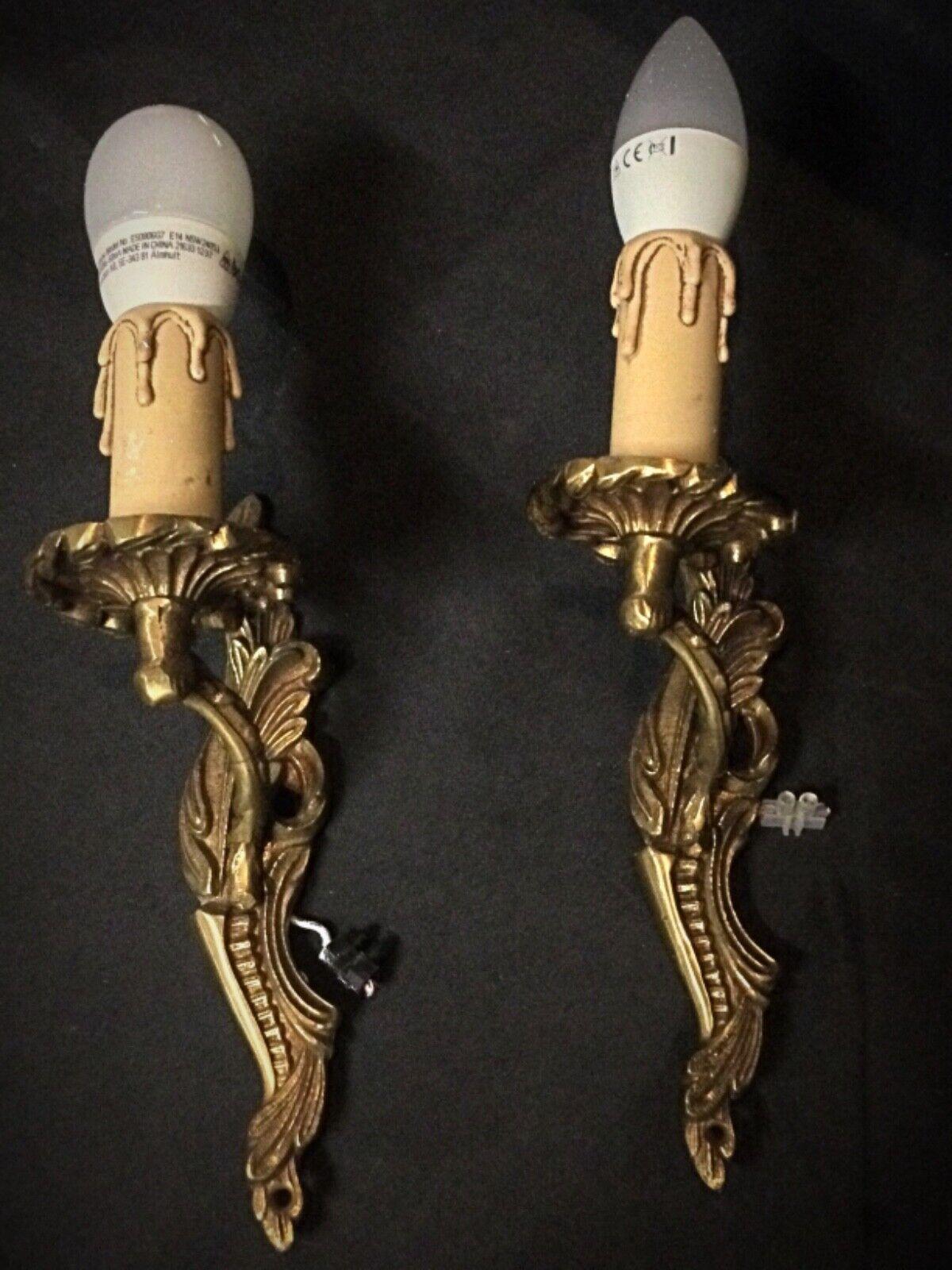This pair of vintage brass wall sconces features a timeless design, perfect for adding a touch of elegance to any room. The intricate detailing and solid brass construction make these sconces a charming addition to your home decor. Although in very
