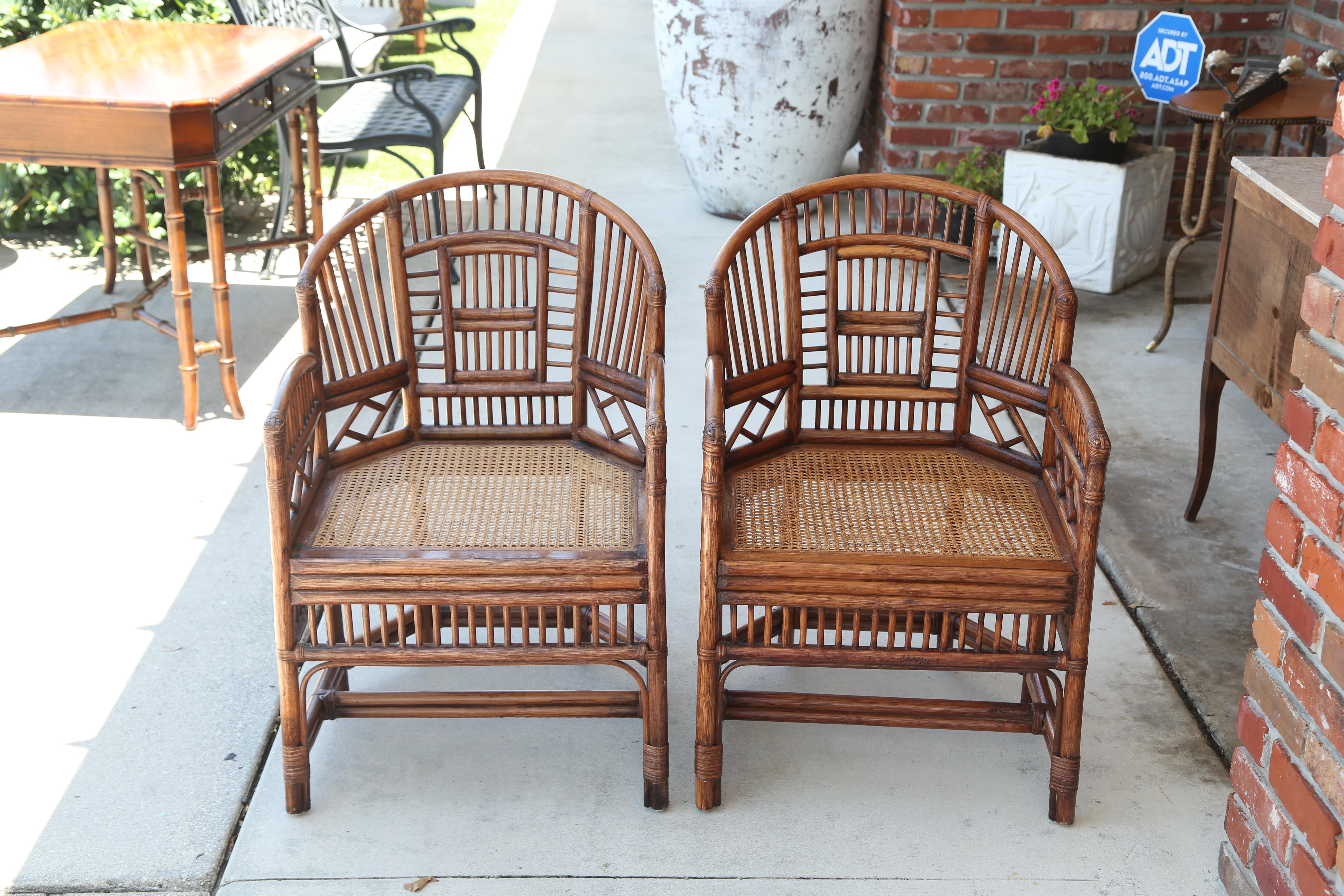 Vintage pair of bamboo Brighton chairs with cane seats.