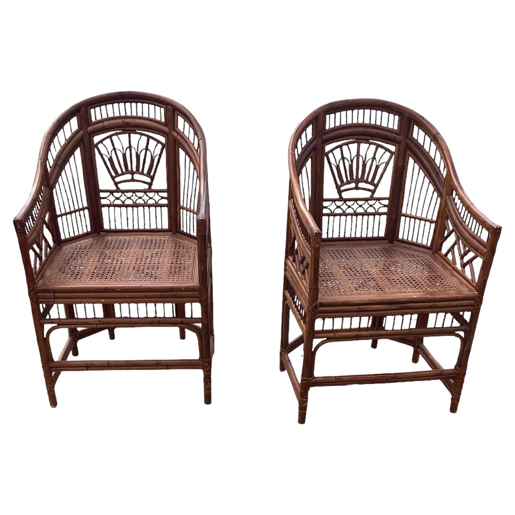 Pair of Vintage Brighton Pavilion Style Chinese Chippendale Rattan and Split Reed Chairs with Caned Seats. Brighton Pavilion refers to the Royal Pavilion in Brighton, England. It is a famous and distinctive building with architectural and design