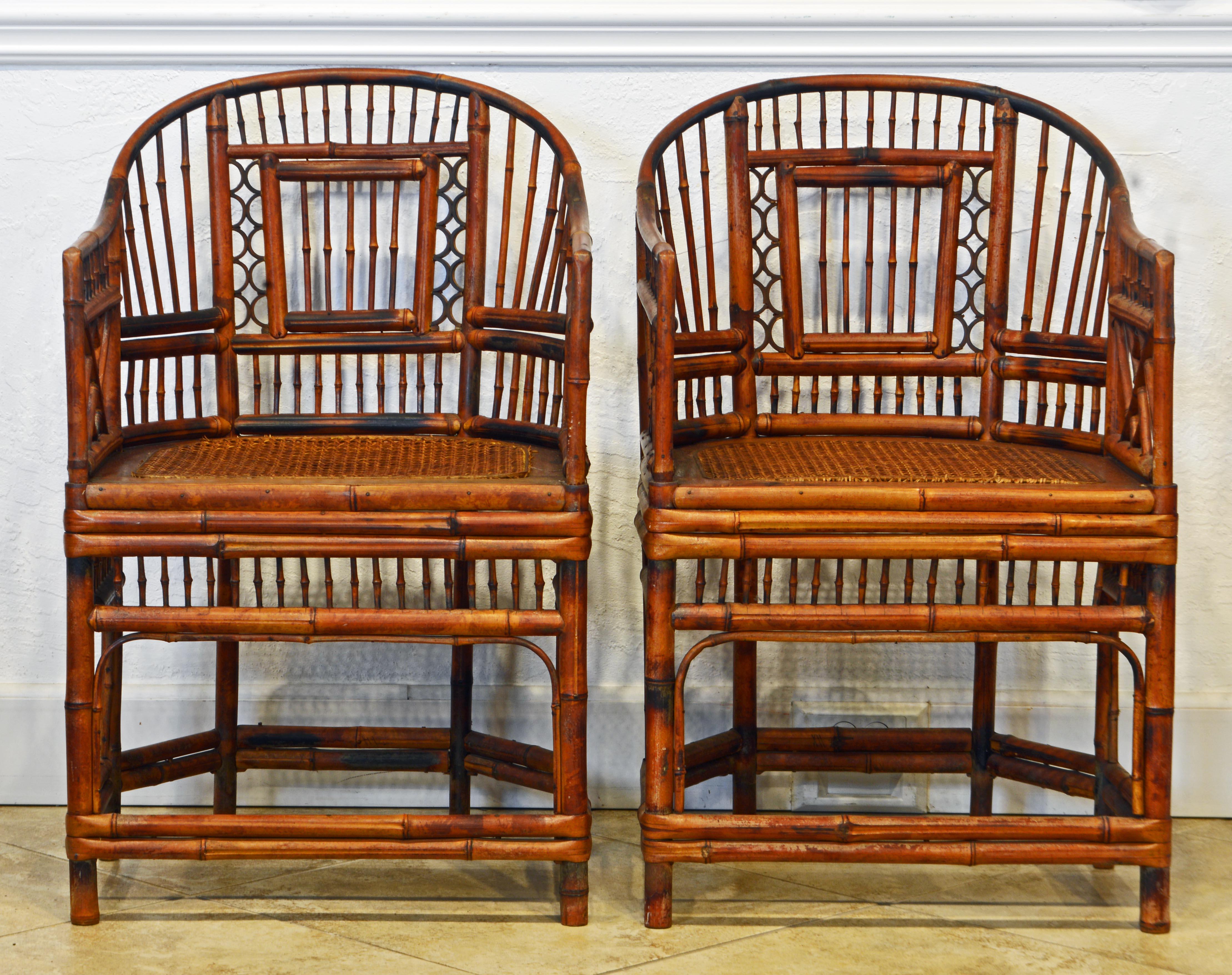 Rising on six legs these intricately crafted iconic armchairs with cane seats feature bamboo frames and Chinese themed bamboo open work inspired by Chippendale design. The chairs come with beautiful cushions in great condition.
  