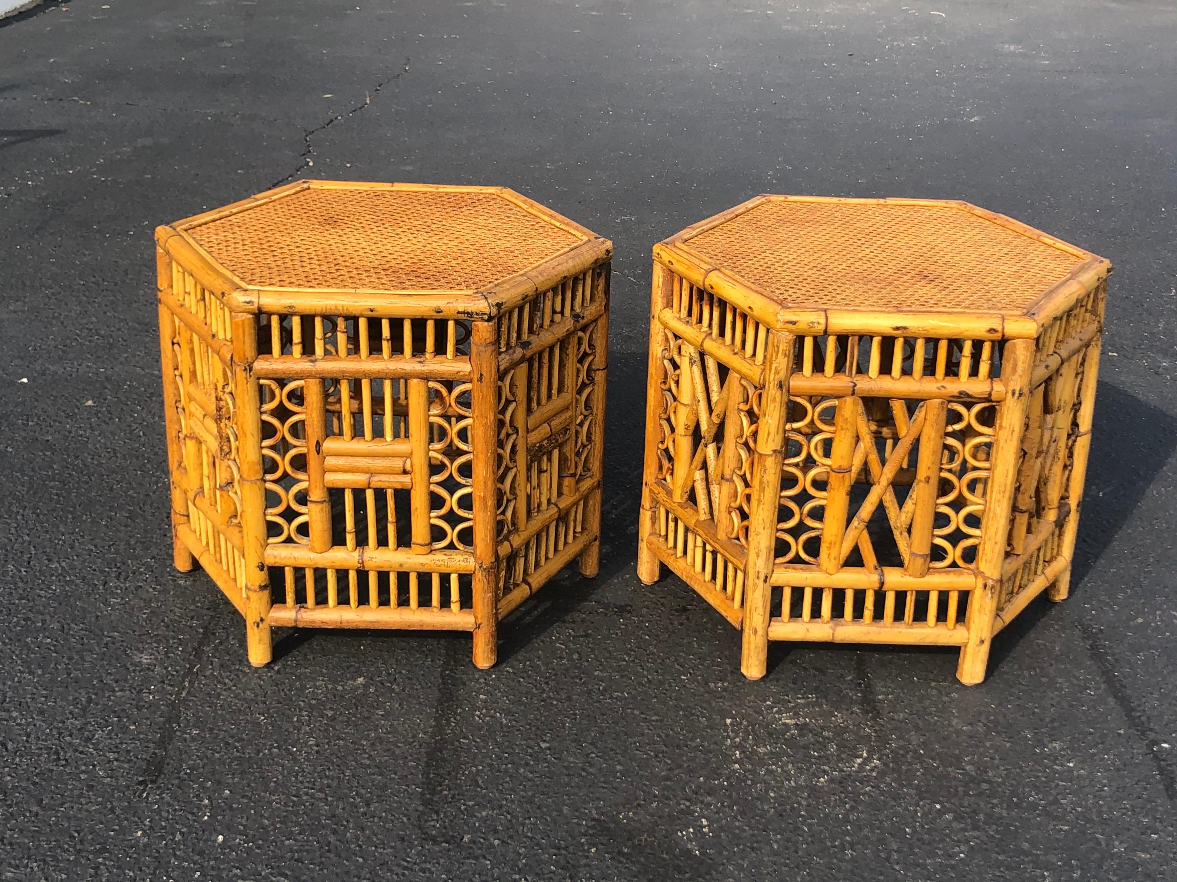 Pair of vintage Brighton style bamboo tables. These are identical in size but they vary in pattern. They are not matching tables. Please look at photos closely. Stron quality. Wicker table top over solid wood. Signed Calif-Asia underneath, from the