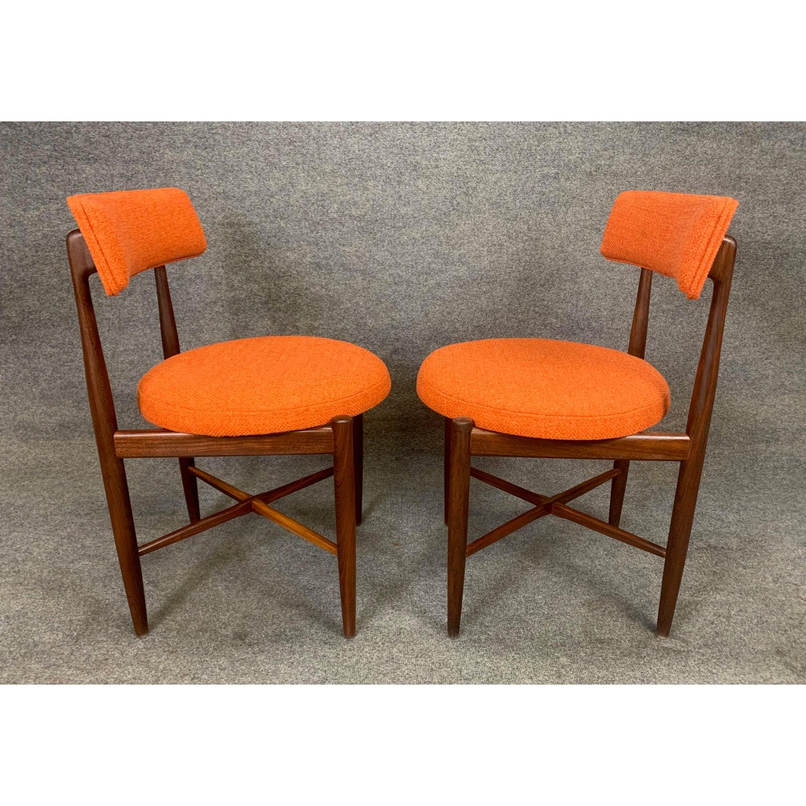 Here is an exquisite pair of vintage side chairs in teak wood designed by Victor Wilkins and manufactured in England in the 1960s. These lovely and comfortable chairs, recently imported form the UK to California before their restoration, feature a