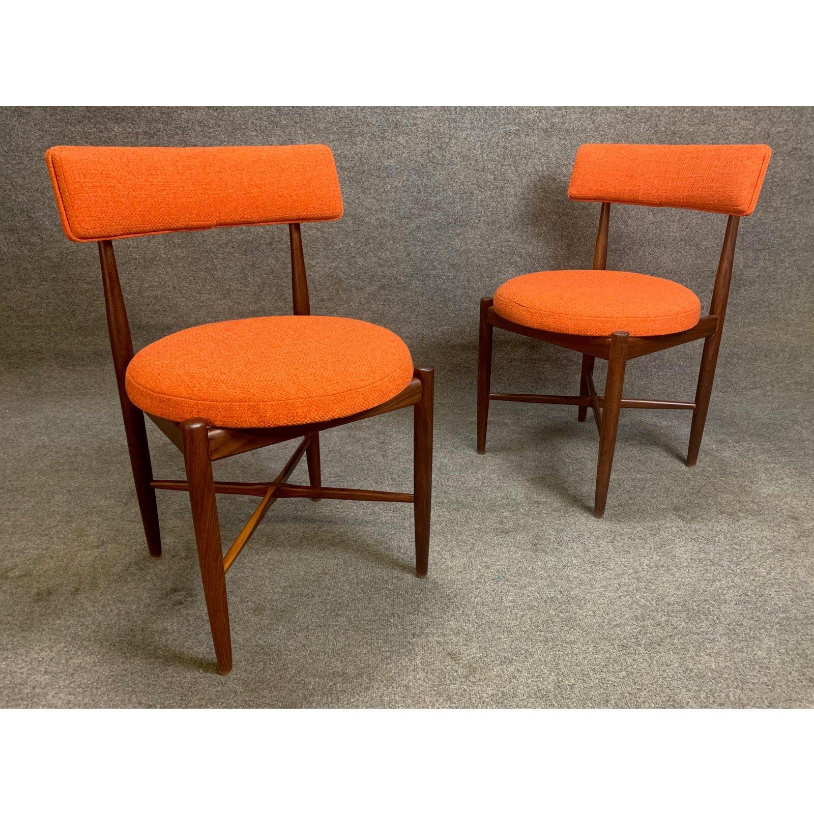 Here is an exquisite set of two vintage dining chairs in teak wood designed by Victor Wilkins and manufactured in England in the 1960s. These lovely and comfortable chairs set, recently imported form the UK to California before their restoration,