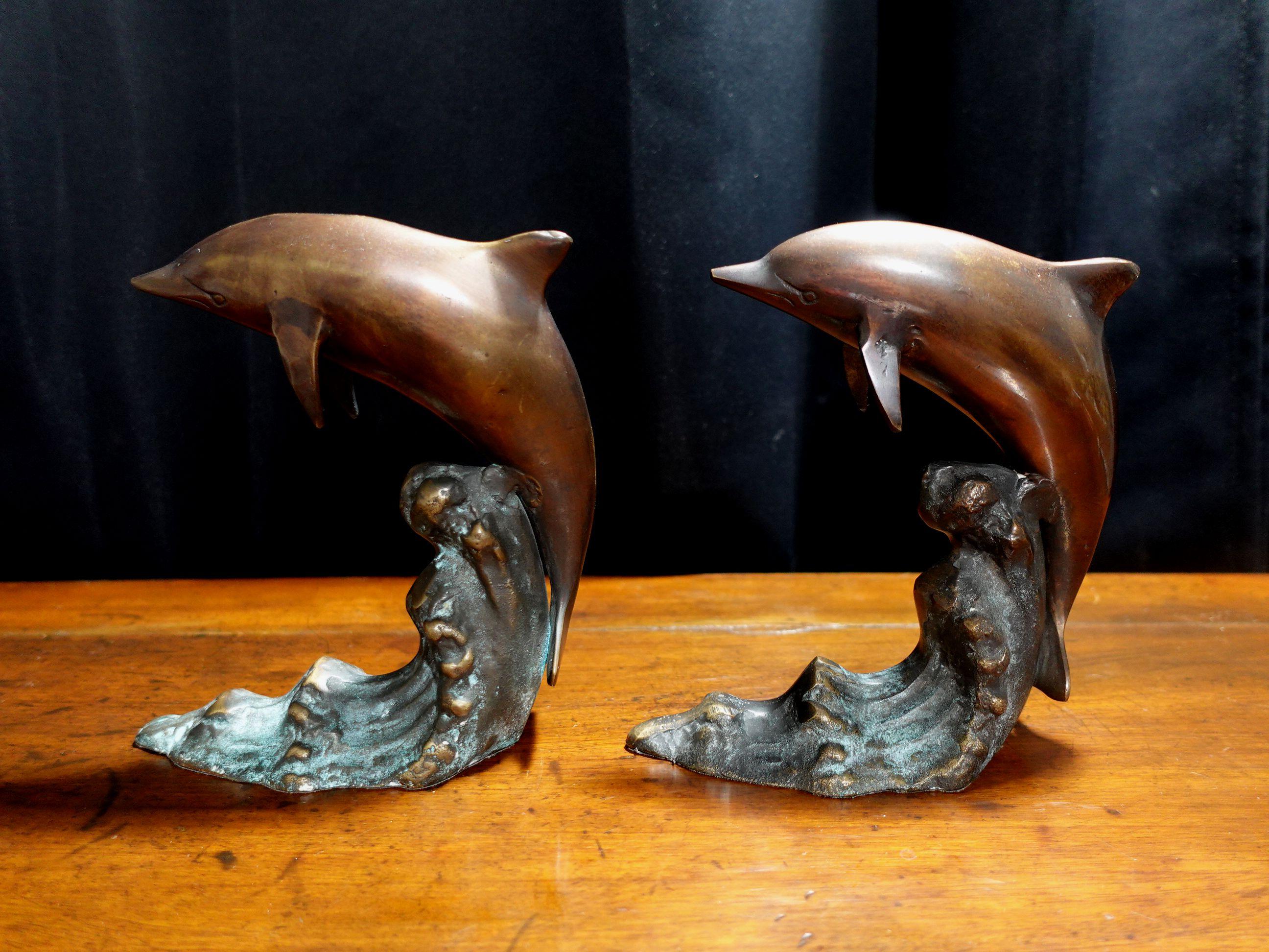 A pair of bookend dolphins made in bronze from the mid 20th century are very cute objects and nice to display with your books together.
 