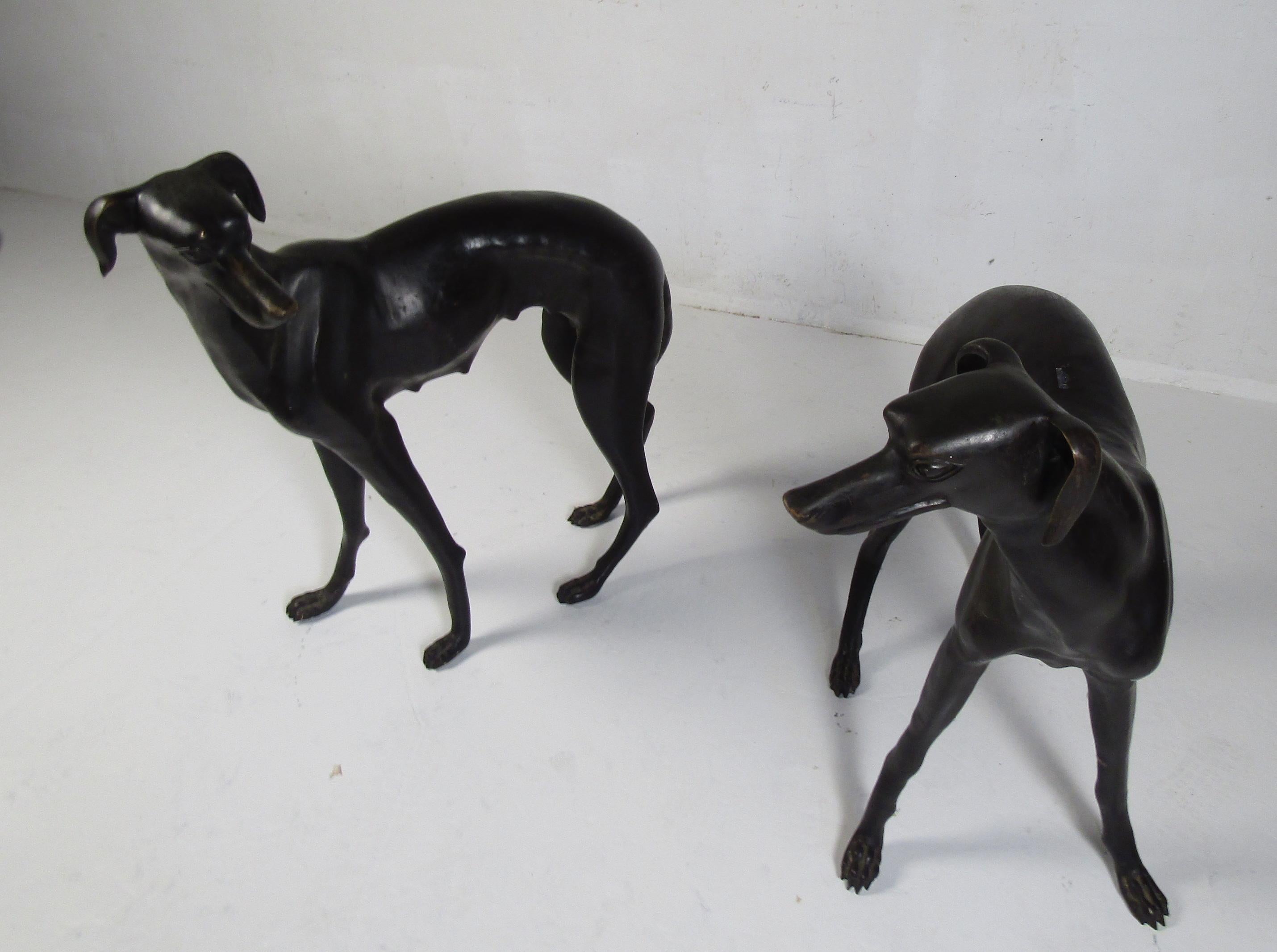 This stunning pair of vintage bronze dog statues look great at the top of any driveway or in the backyard. A well-made heavy design with lovely detail from the head to the feet. This unique pair of garden ornaments make the perfect addition to any