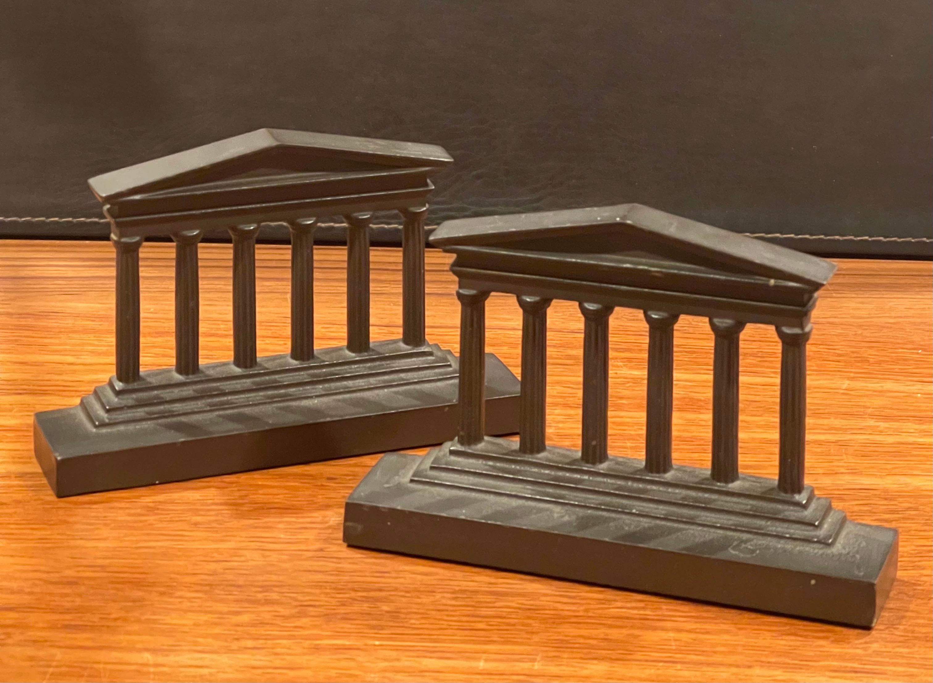Very heavy pair of vintage bronze Greek columns / Parthenon bookends, circa 1940s. The bookends are in very good vintage condition with a nice patina. and measure 7