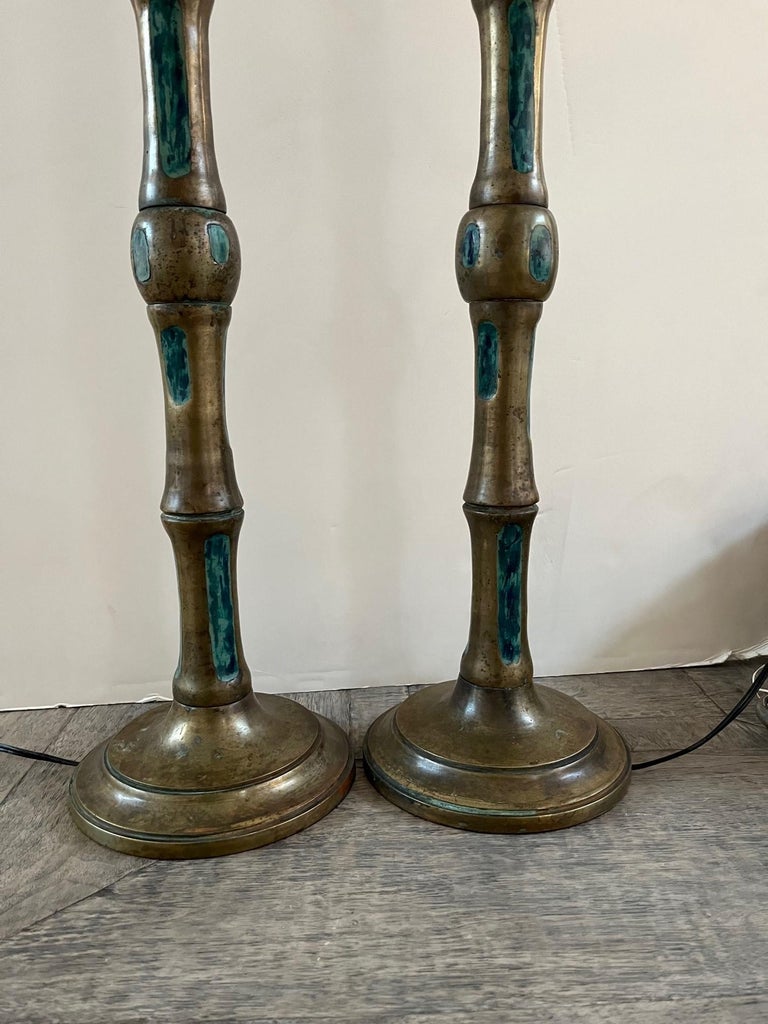 Pair of vintage bronze table lamps designed by Pepe Mendoza, designed with Faux Bamboo Stalk Motif in bronze, inlaid with enameled Turquoise Ceramic, Includes two matching silk shades,
In style Mid-Century Modern, on circular bases marking include