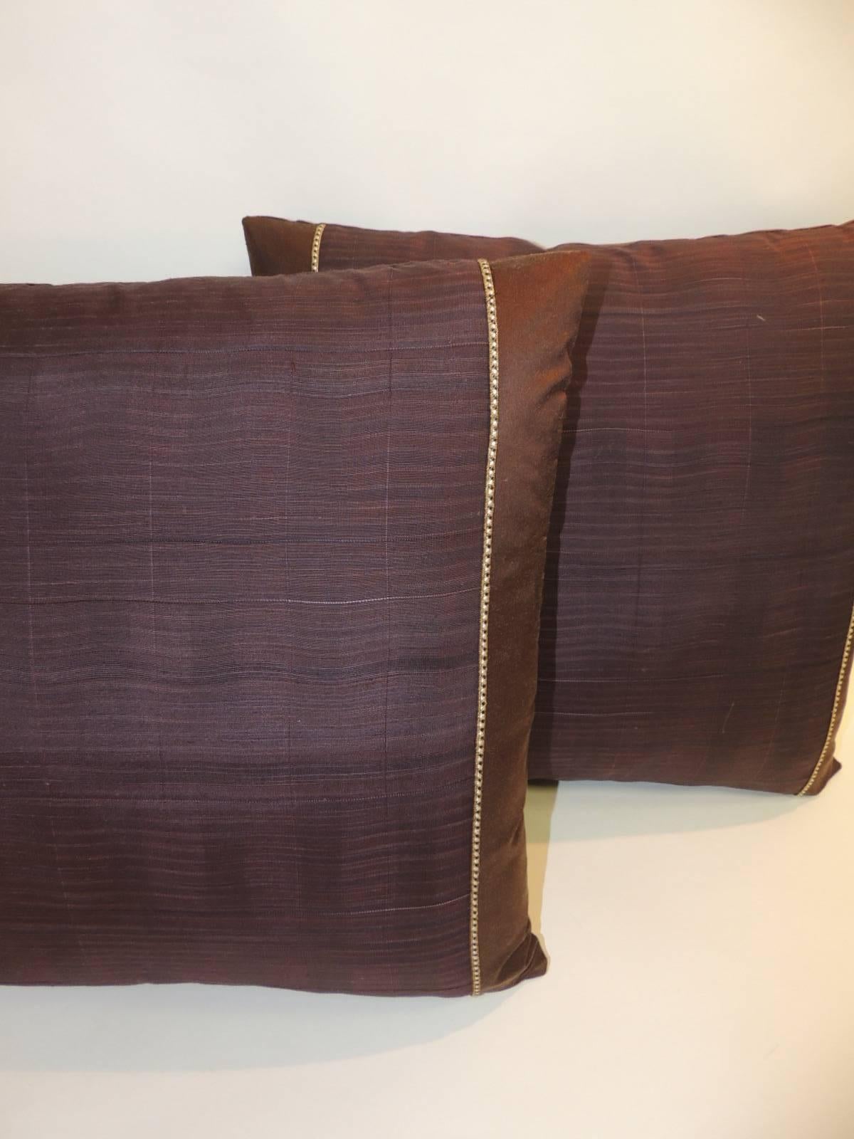 Iridescent Obi pillows textile framed with chocolate brown silk and embellished with a small woven trim in shades of gold, black and white. Backing of decorative pillows is the same as the frame in the front. Decorative square pillows handcrafted