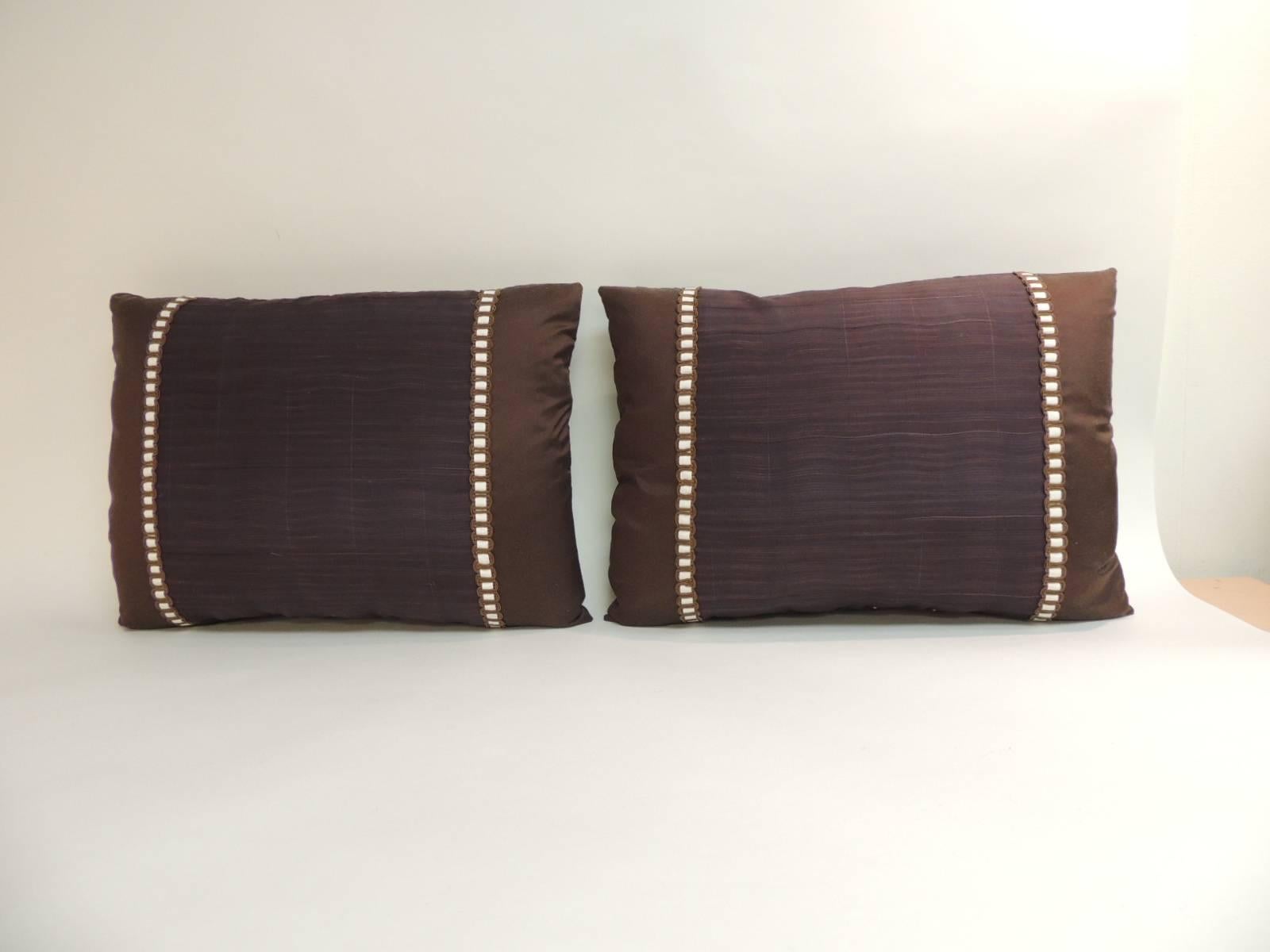 Pair of vintage brown and purple woven Obi textile bolsters decorative pillows.
Woven vintage decorative pillows handcrafted from an iridescent obi textile. Bolster decorative pillows framed with chocolate brown silk. Throw pillows embellished with