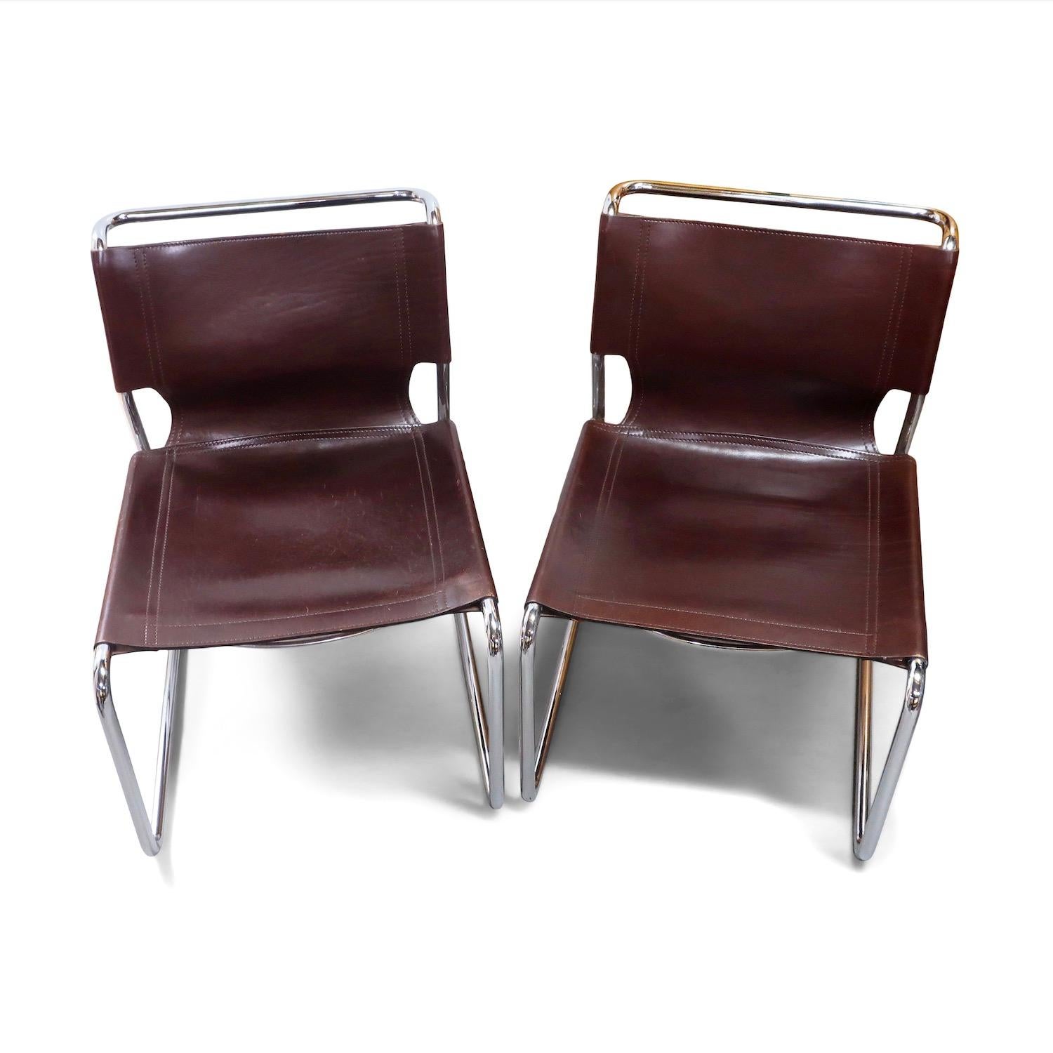 A very comfortable pair of brown leather and chrome chairs in the style of Marcel Breuer and Mart Stam's classic Bauhaus experiments with bent metal and cantilever chairs. Ingeniously designed with chrome supports that resemble a single piece of