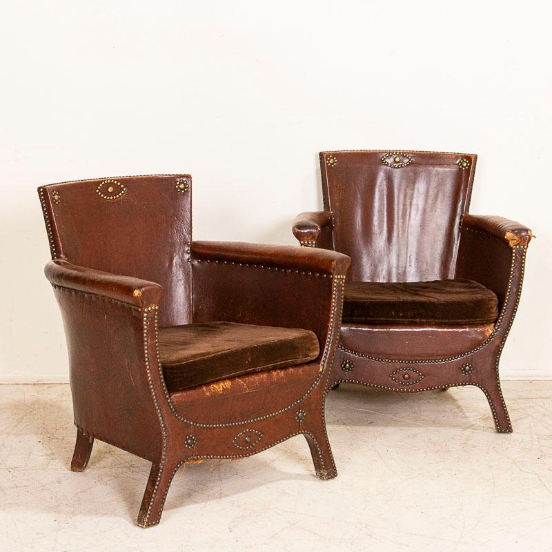 Vintage pair of club or lounge chairs designed by Otto Schultz and produced by Boet of Goteburg, Sweden. The notable use of nail heads as decoration were one of Schultz's style statements. This attractive pair is in original condition with nail