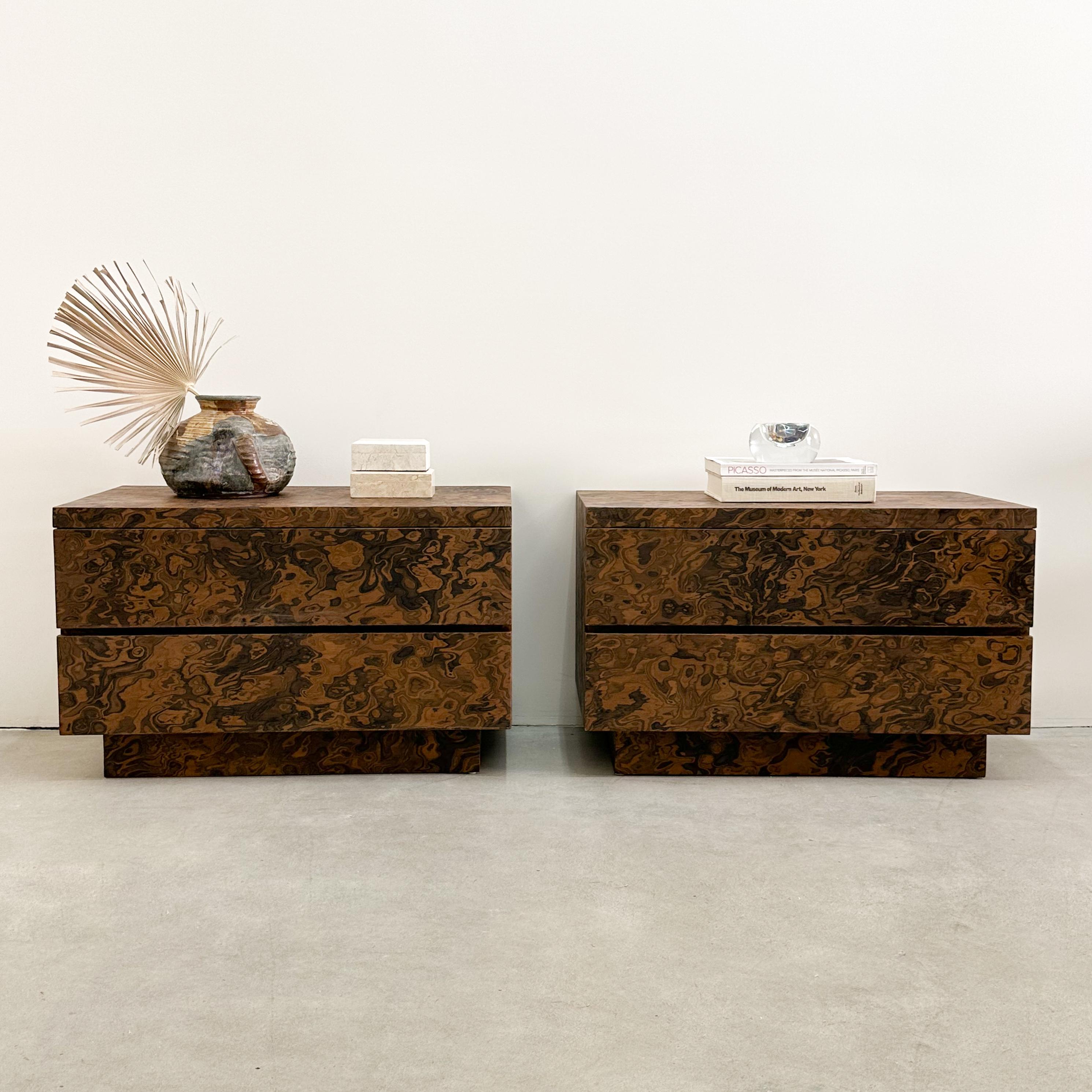 Pair of Vintage Burlwood Veneer Nightstands.

The vintage nightstands have been meticulously re-veneered with burlwood manufactured by ALPI and have been carefully applied and sealed with a satin finish, enhancing their durability.

Color: Shades of