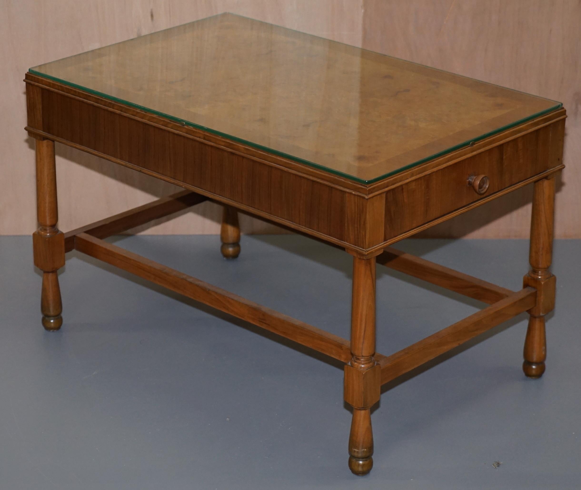 We are delighted to this stunning pair of vintage Burr Walnut side tables with glass tops and double drawers either end

A very good looking and versatile pair of side tables, I have never seen a pair this deep before and never seen any with
