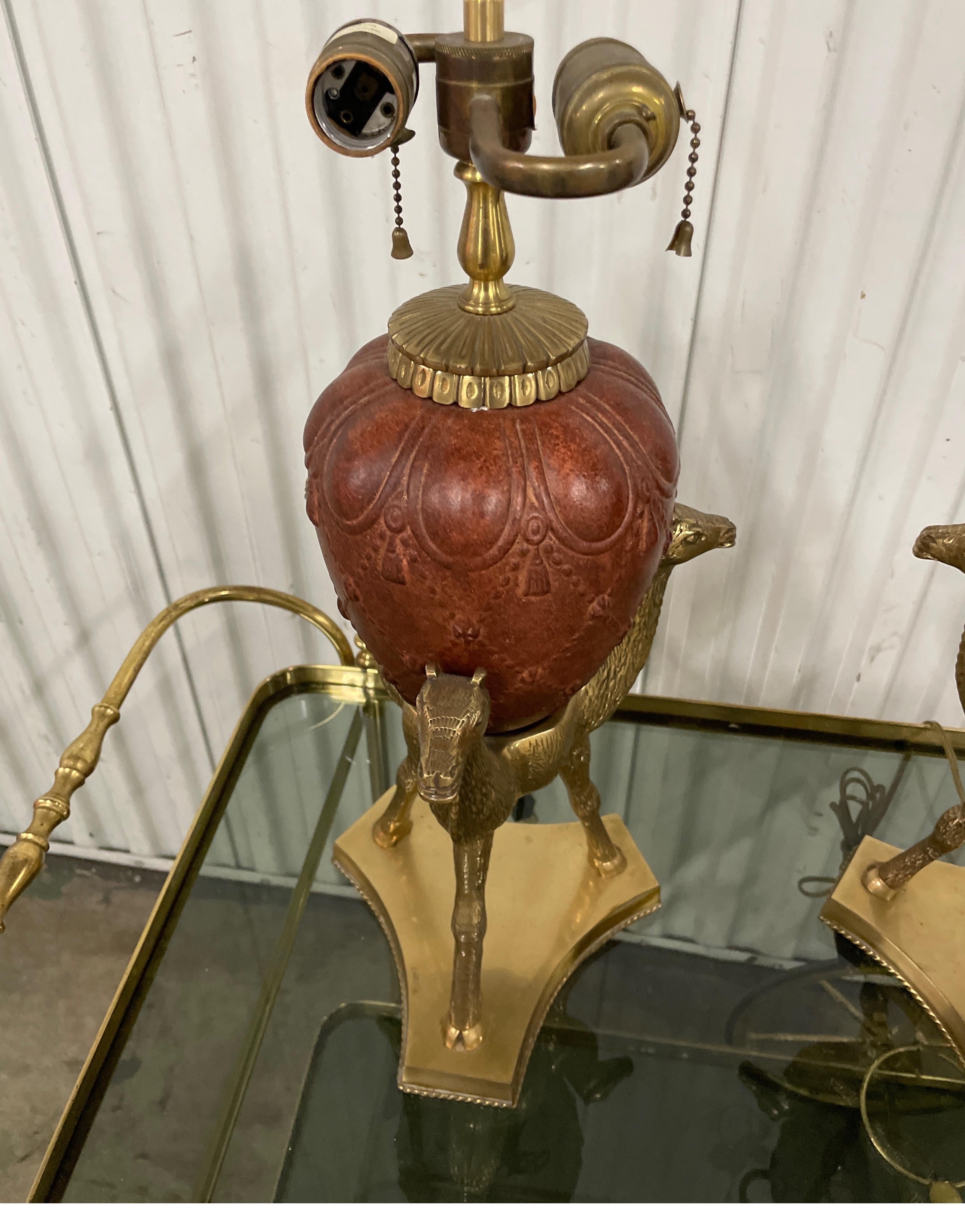 Pair of Vintage Chapman Camel Table Lamps with solid brass tripod base supporting an urn.  A very unique and rare pair. No lampshades.
