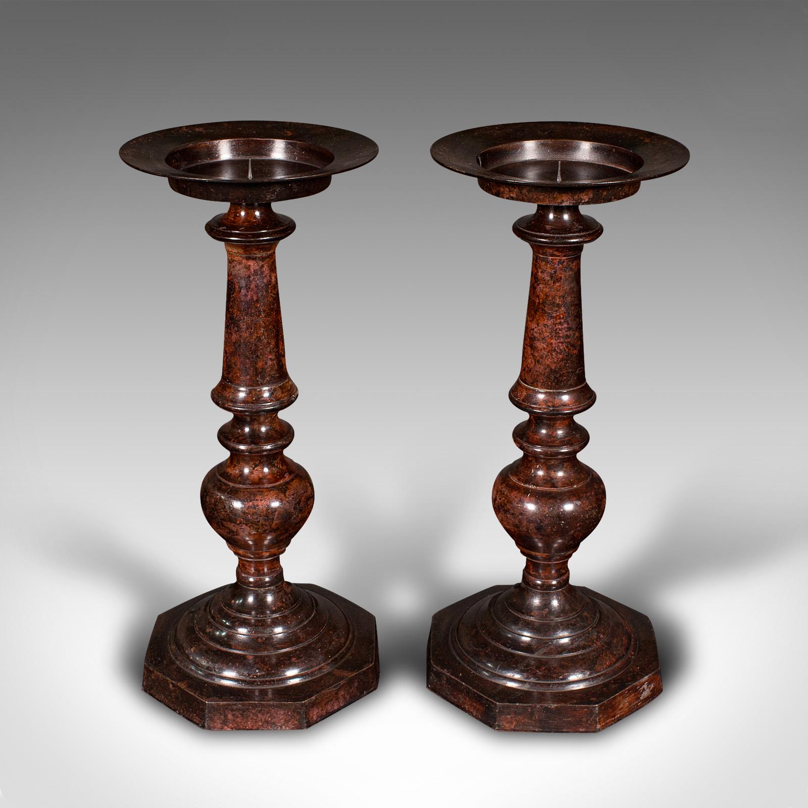 
This is a pair of tall vintage candle prickets. An English, painted cast metal candlestick in ecclesiastical taste, dating to the Art Deco period, circa 1930.

Tastefully decorative candlesticks with a distinctive finish
Displaying a desirable aged